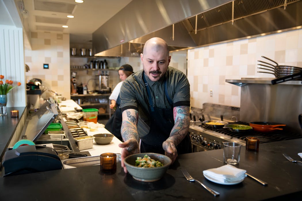 Chef Eric Simpson serves up a pasta dish at Herbst Eatery & Farm Stand in St. Paul, which opened in May.