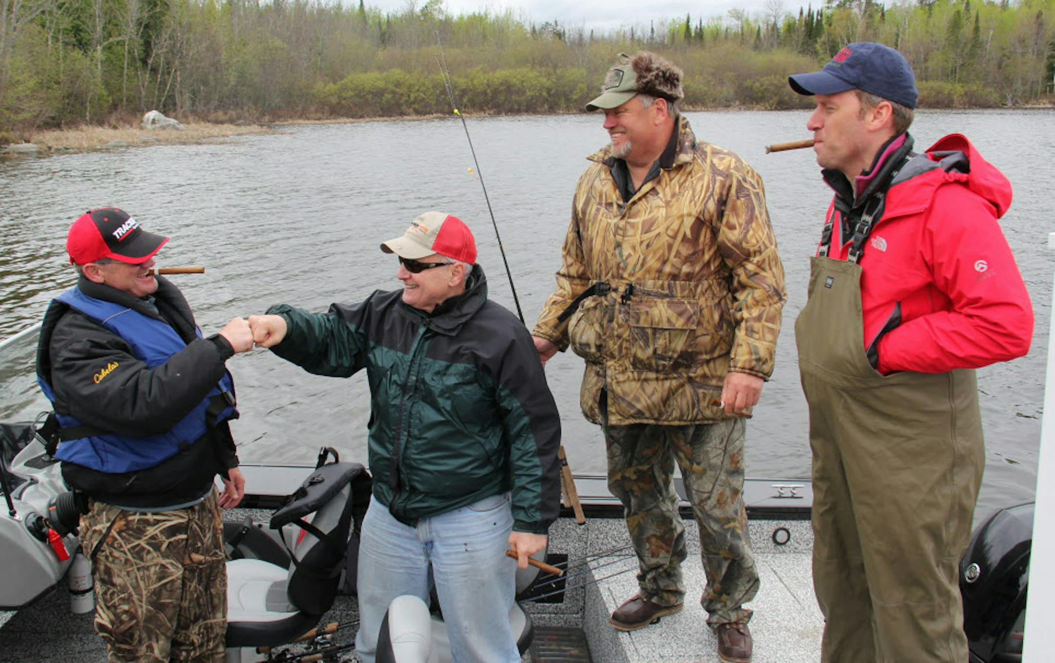 Governor Dayton thanks his fishing guide, Buck Lescarbeau, with a fist bump after a successful fishing expedition. Governor Mark Dayton, Majority Leader Tom Bakk and Speaker Kurt Daudt an fish opener experience fishing Lake Vermilion together Saturday, May 9,2015 ORG XMIT: MIN1505091749360168