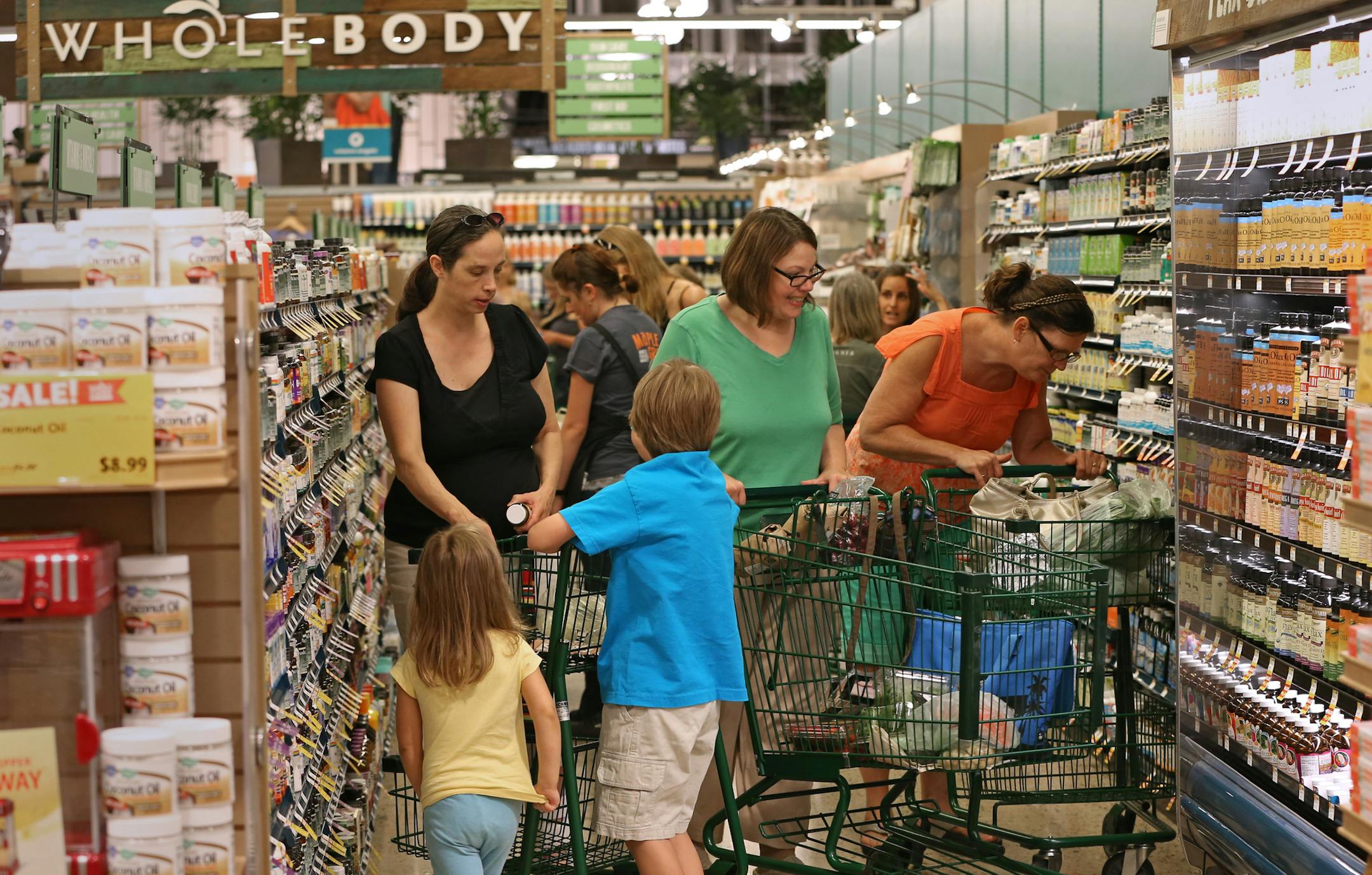 The lanes were jammed with shoppers as Whole Foods opened its new store at the Shoppes at Arbor Lakes in Maple Grove on Wednesday.