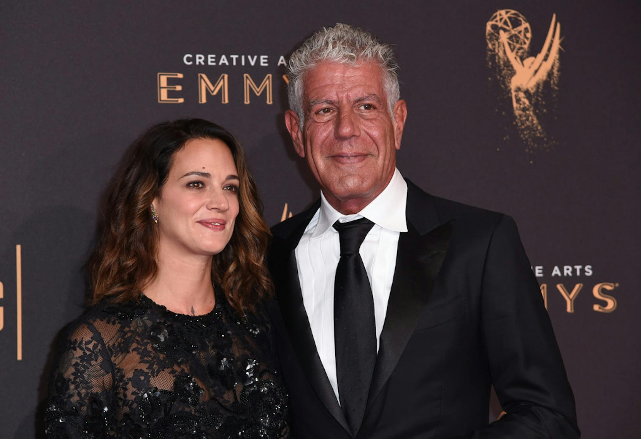 Asia Argento, left, and Anthony Bourdain arrive at night one of the Creative Arts Emmy Awards at the Microsoft Theater on Saturday, Sept. 9, 2017, in Los Angeles.