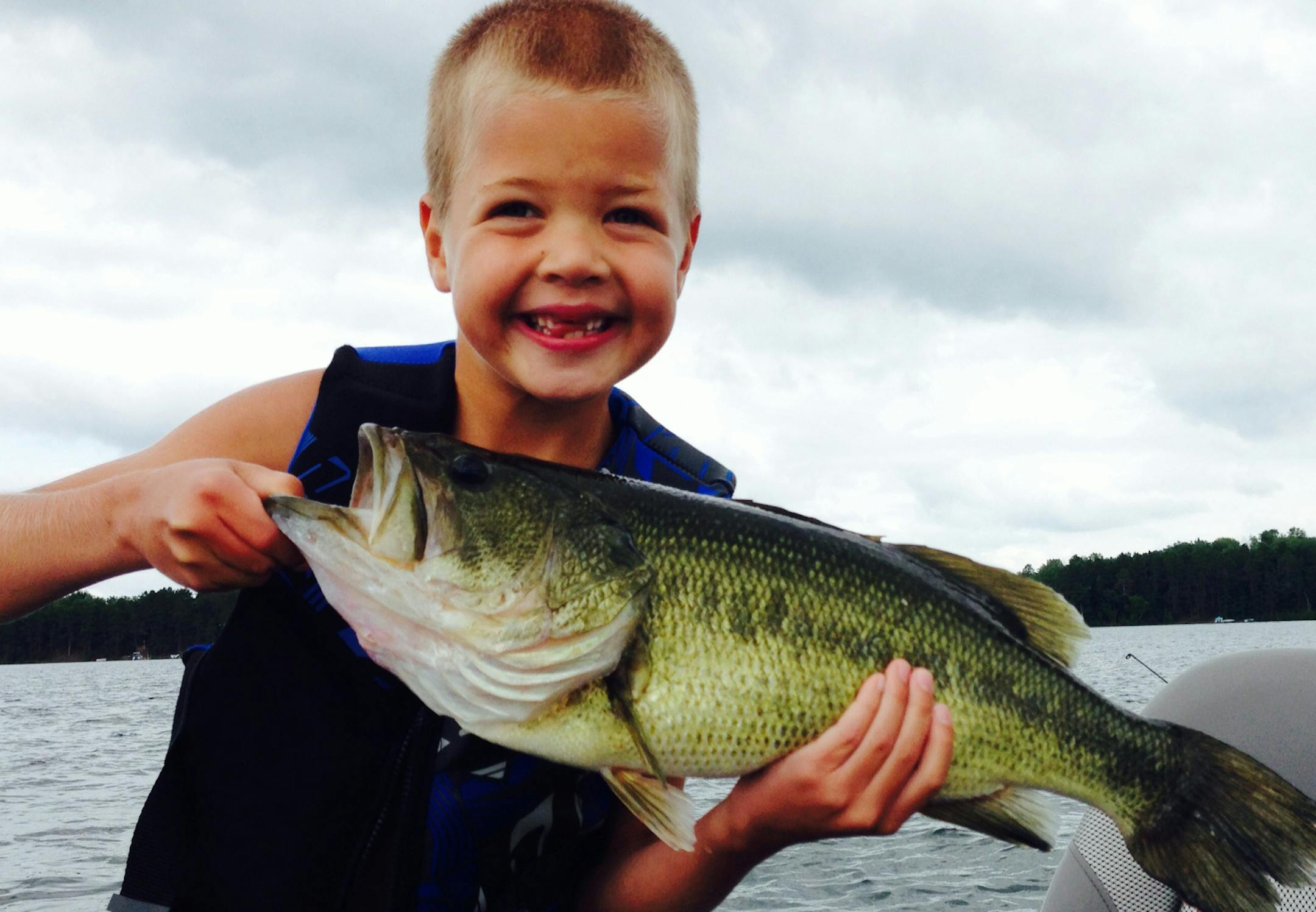SHOW AND TELL Nathan Benson, 7, of Minneapolis caught and released this 21-inch largemouth bass on his last weekend of summer break on a lake near Danbury, Wis. " He's been waiting a long time to catch a big fish, let alone this fish of a lifetime,'' said his mom, Linnea. "What a story to head back to school with!"