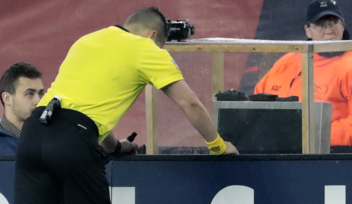 FOXBOROUGH, MA - APRIL 06: Referee Jose Carlos Rivero watches a replay of a penalty kick call during a match between the New England Revolution and the Montreal Impact on April 6, 2018, at Gillette Stadium in Foxborough, Massachusetts. The Revolution defeated the Impact 4-0. (Photo by Fred Kfoury III/Icon Sportswire) (Icon Sportswire via AP Images) ORG XMIT: 307116