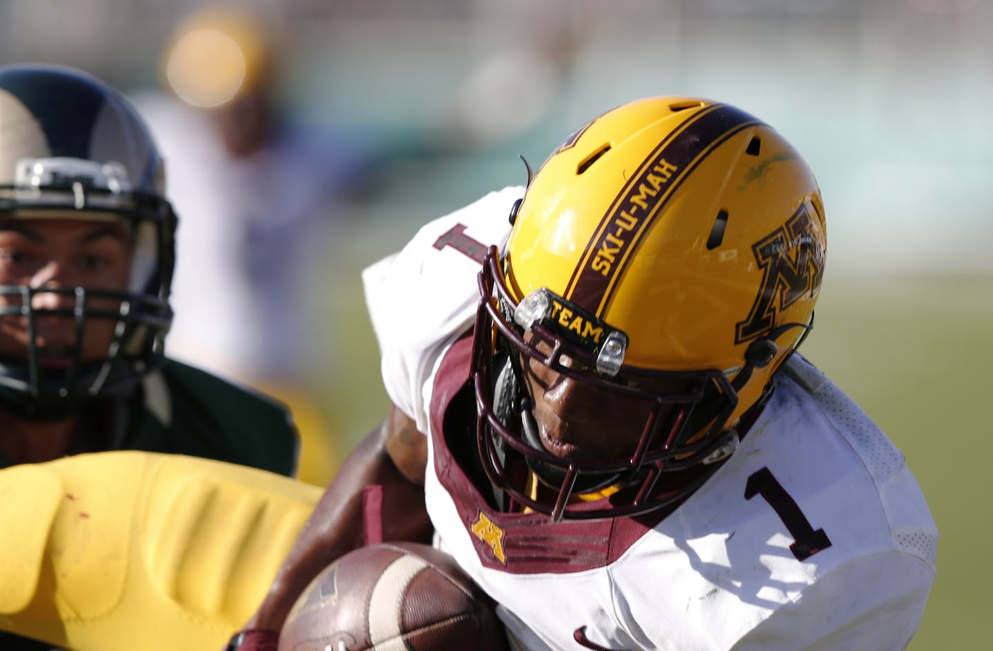 Minnesota wide receiver KJ Maye, front, pulls in a pass for a touchdown against Colorado State late in the fourth quarter of an NCAA college football game Saturday, Sept. 12, 2015, in Fort Collins, Colo. Minnesota won 23-20 in overtime. (AP Photo/David Zalubowski)