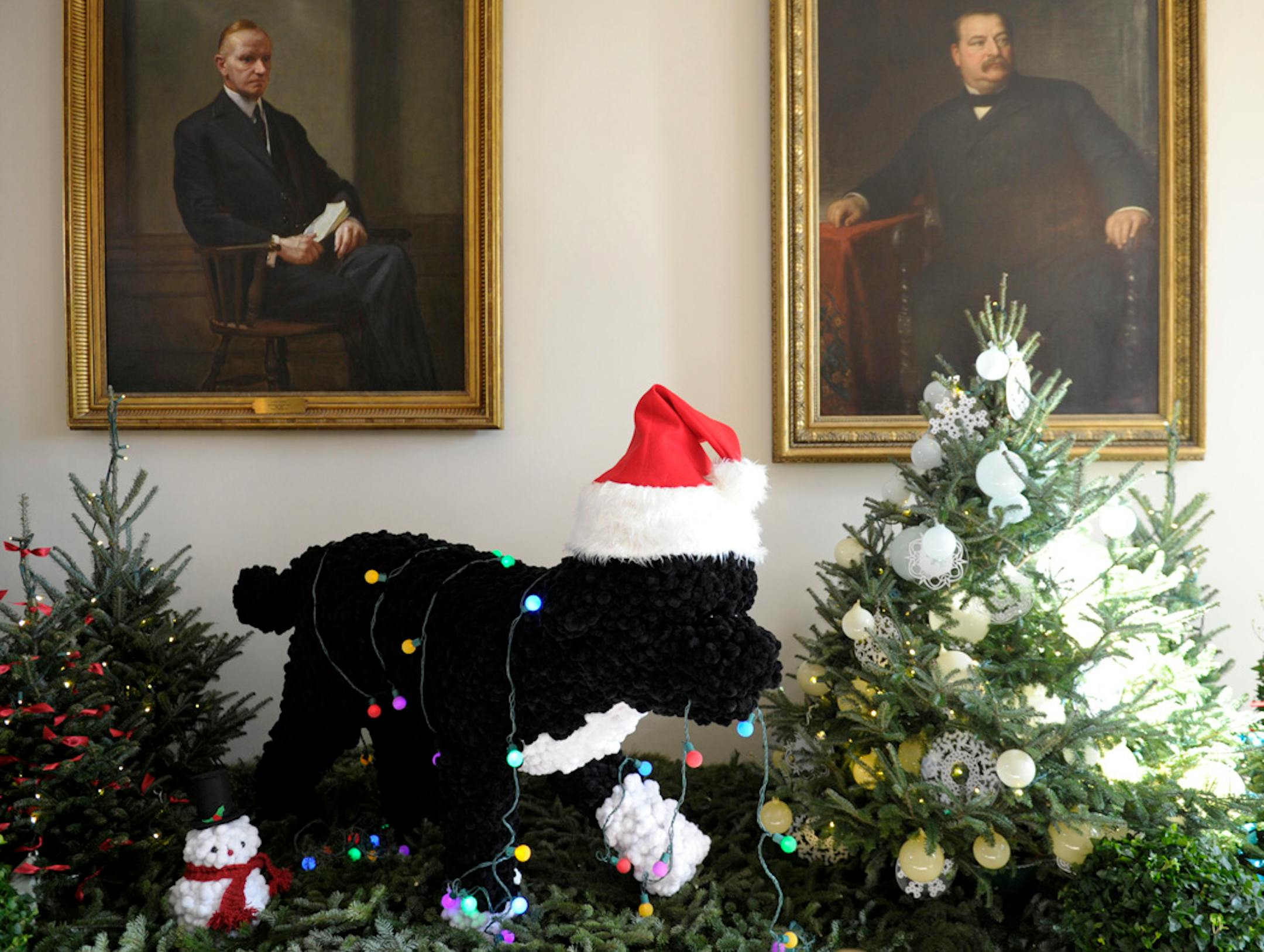 A life-sized replica of the Obama family dog, Bo, a Portuguese Water Dog, is the centerpiece of the East Garden Room of the White House in Washington, Wednesday, Nov. 28, 2012. The theme for the White House Christmas 2012 is Joy to All. (AP Photo/Susan Walsh)