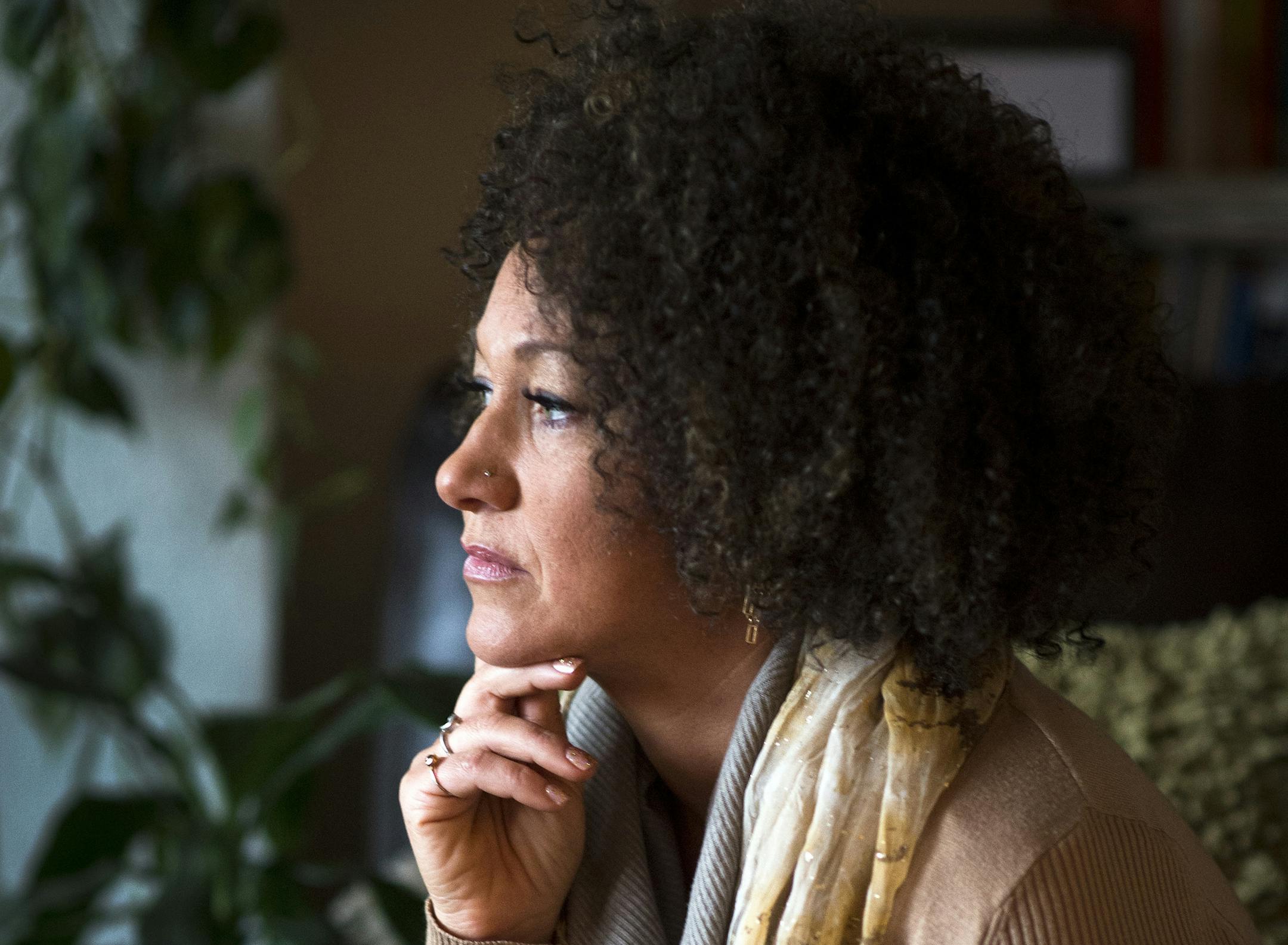 FILE - In this March 2, 2015, file photo, Rachel Dolezal, president of the Spokane chapter of the NAACP, poses for a photo in her Spokane, Wash., home. Dolezal resigned Monday, June 15, 2015, amid a furor over racial identity that erupted when her parents came forward to say she has been posing as black for years when she is actually white. (Colin Mulvany/The Spokesman-Review via AP, File)
