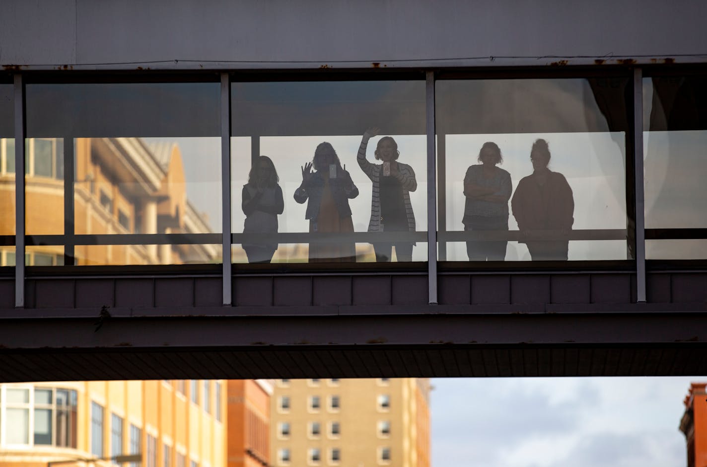 Local Duluth residents stood in the skywalk over Superior Street to watch the Veterans Day March,