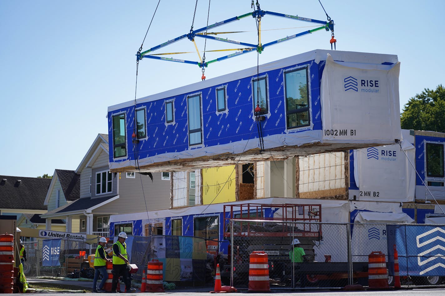 A crane Friday stackas one of 27 box units that will completed the Mod42 apartment complex being built in south Minneapolis. (Shari L. Gross/Star Tribune)