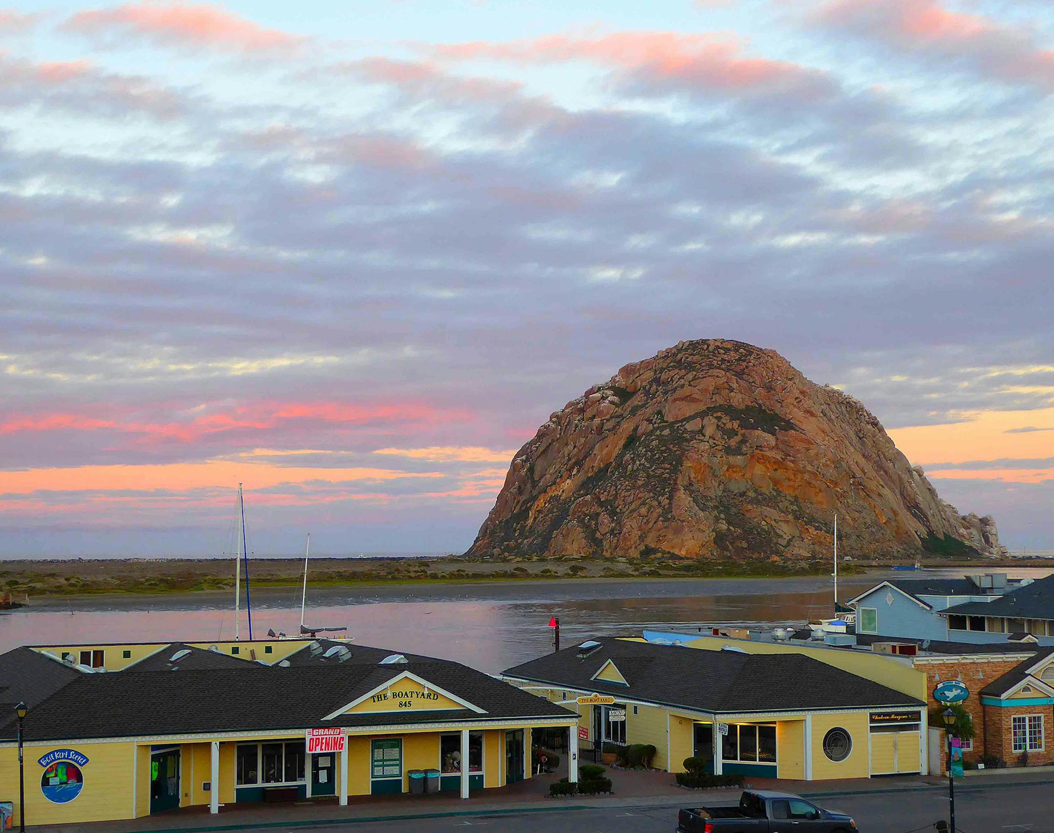 Morro Rock stands silgouetted against the reflected colors of the dawn sky. (Patricia Harris/TNS)