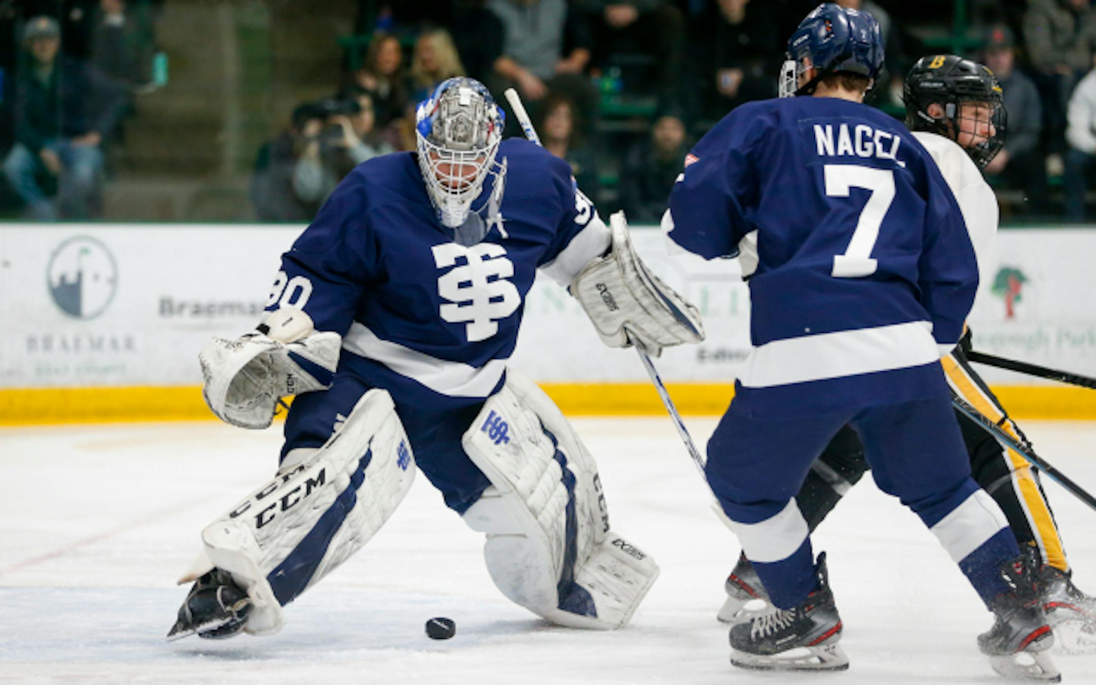 St. Thomas Academy's Tommy Aitken (30) makes a skate save on a deflection in front of the net against Burnsville Thursday night. Aitken had 29 saves in the Cadets 2-0 victory over the Blaze at Braemar Arena. Photo by Jeff Lawler, SportsEngine