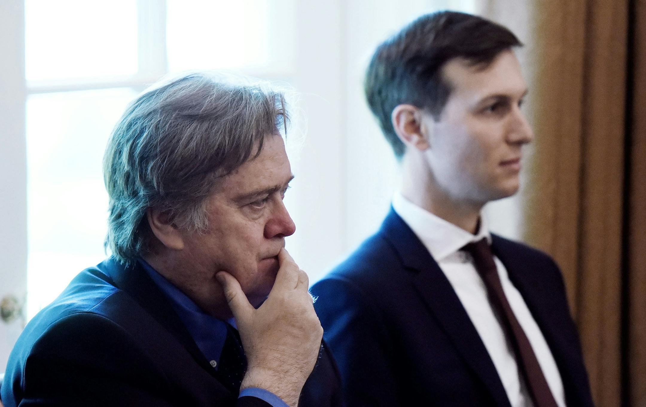 Jared Kushner, right, and Steve Bannon listen during a Cabinet meeting in the Cabinet Room of the White House, on June 12, 2017, in Washington, D.C. (Olivier Douliery/Abaca Press/TNS)