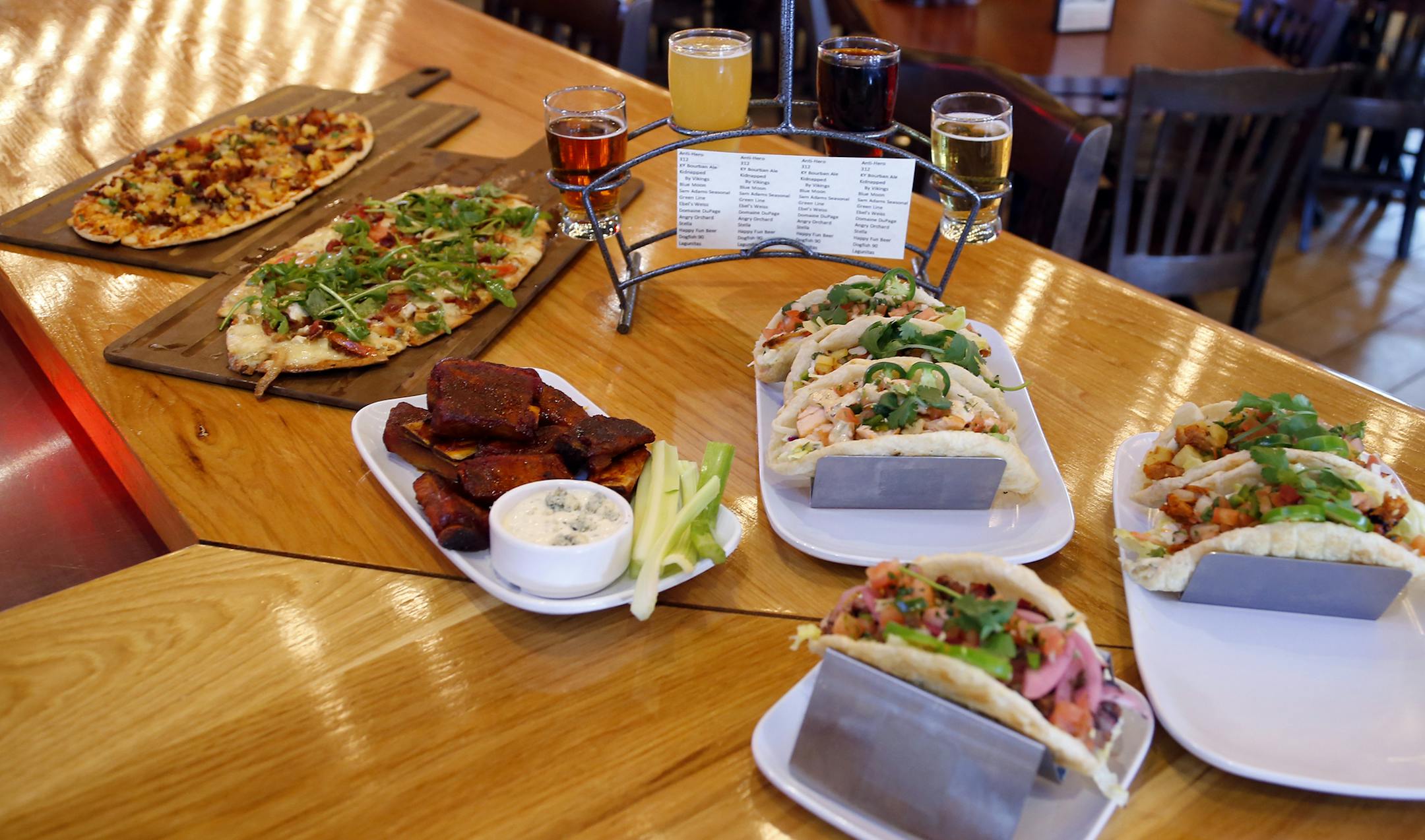 Some of the new food items and craft beers on display at the newly remodeled Famous Dave's Legendary Pit Bar-B-Que restaurant on Wednesday, March 4, 2015, in Bolingbrook, Illinois, (AP Photo/Jeff Haynes) ORG XMIT: ILJH114