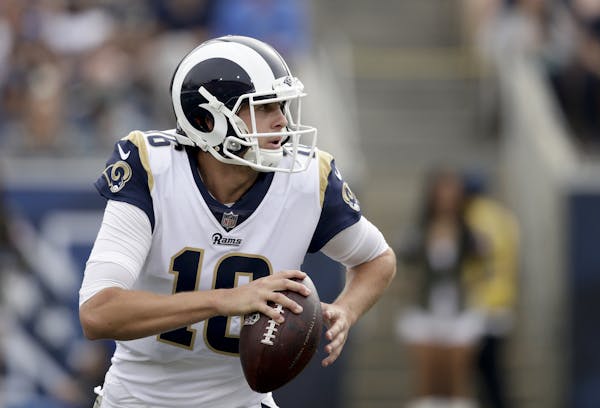 Los Angeles Rams quarterback Jared Goff looks to pass against the Houston Texans during the first half of an NFL football game Sunday, Nov. 12, 2017, 