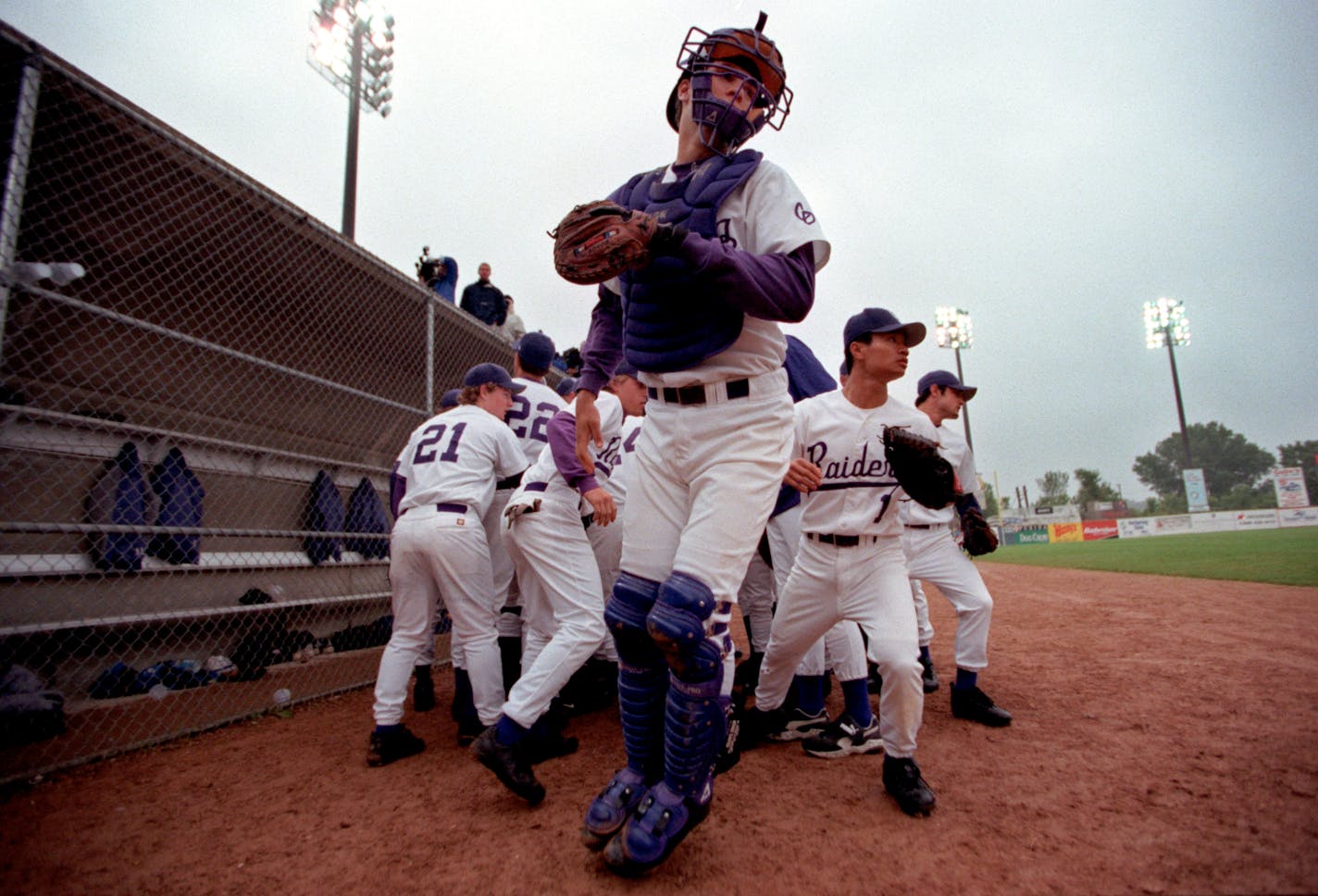 In 2001, Joe Mauer (middle) helped Cretin-Derham Hall win a section and a state title at St.&#x202f;Paul&#x2019;s Midway Stadium.