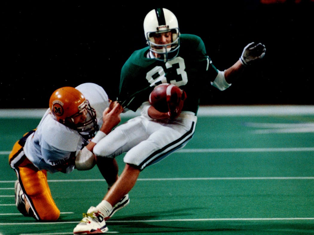 Waterville-Elysian’s Corey Neid (83) was tackled after a short gain against Mahnomen in the Prep Bowl’s Class C championship game in 1989.