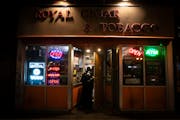 Royal Cigar &amp; Tobacco customers walked into the Dinkytown store Sunday, hours after two people were shot and killed there, Minneapolis police said