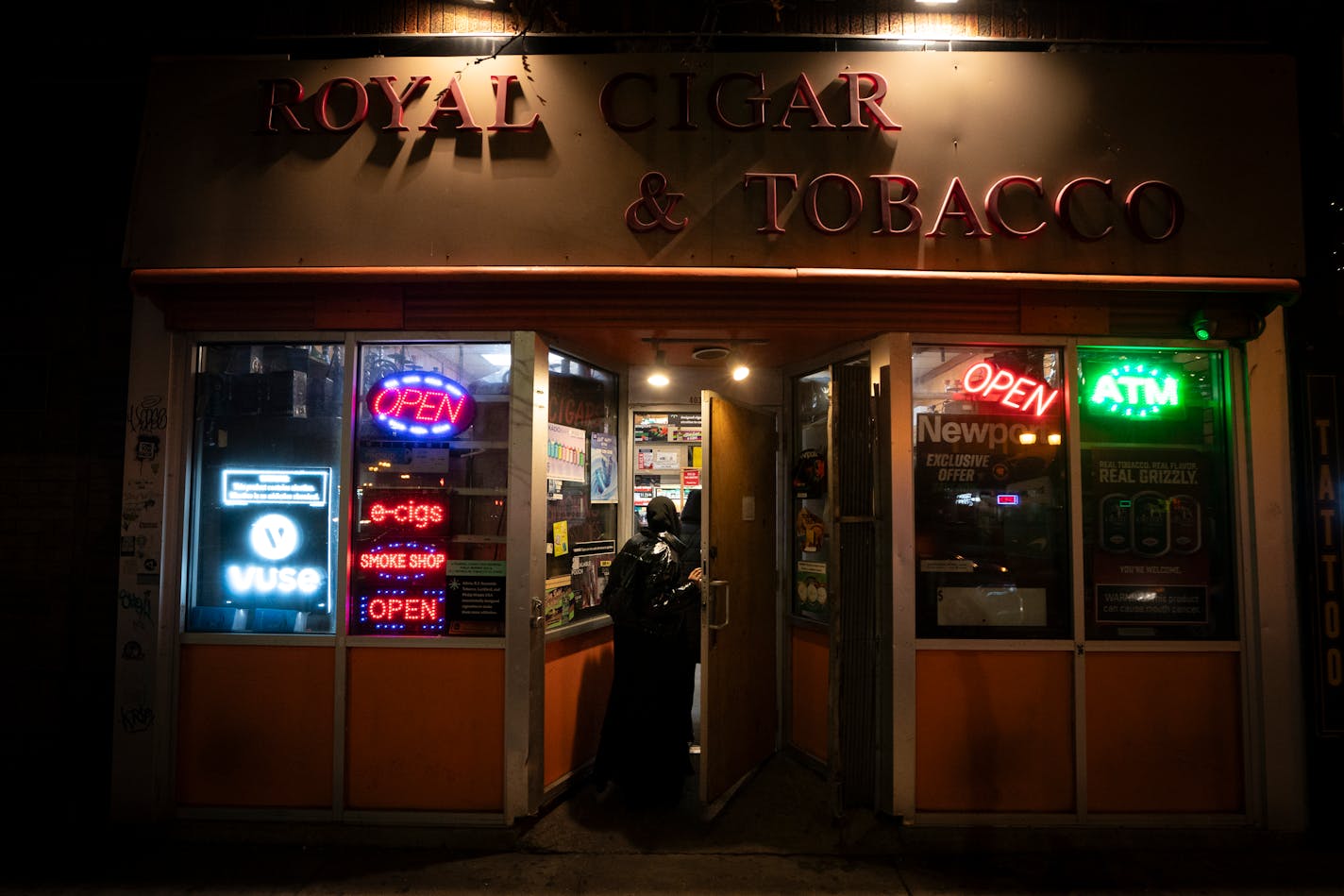 Royal Cigar &amp; Tobacco customers walked into the Dinkytown store Sunday, hours after two people were shot and killed there, Minneapolis police said.