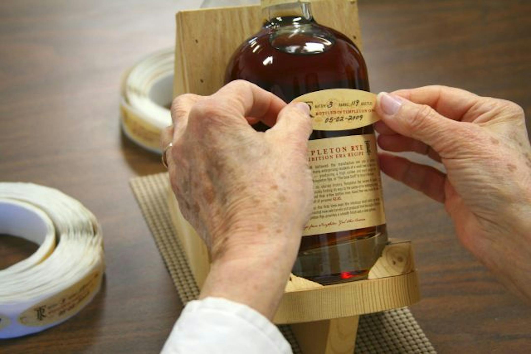Every bottle of Templeton Rye whiskey is labeled by hand.