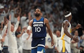 Guard Mike Conley reacts after making a three-point shot Wednesday as the Wolves eliminated the Warriors.