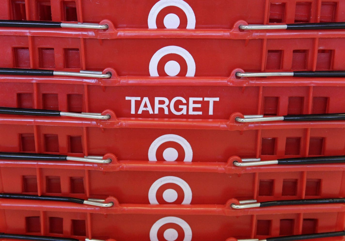 FILE - In this May 20, 2009 file photo, shopping baskets are stacked at a Chicago area Target store. Lean inventory and stronger-than-expected holiday sales helped Target Corp.'s fourth-quarter profit rise 53.7 percent, and the company said Tuesday, Feb. 23, 2010, it expects to pick up market share this year as it rolls out sweeping merchandising initiatives.(AP Photo/Charles Rex Arbogast, File) ORG XMIT: MIN2013042613451080