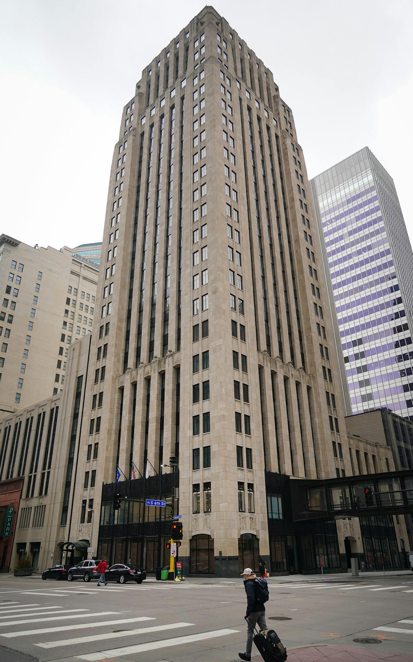 The exterior of the Rand Tower (above). The Rand Tower Club (top) is a fifth-floor addition to the art deco building, which has been transformed into an aviation-themed boutique hotel that offers views of the Mississippi River and a $10 million staircase that winds down all 26 floors.