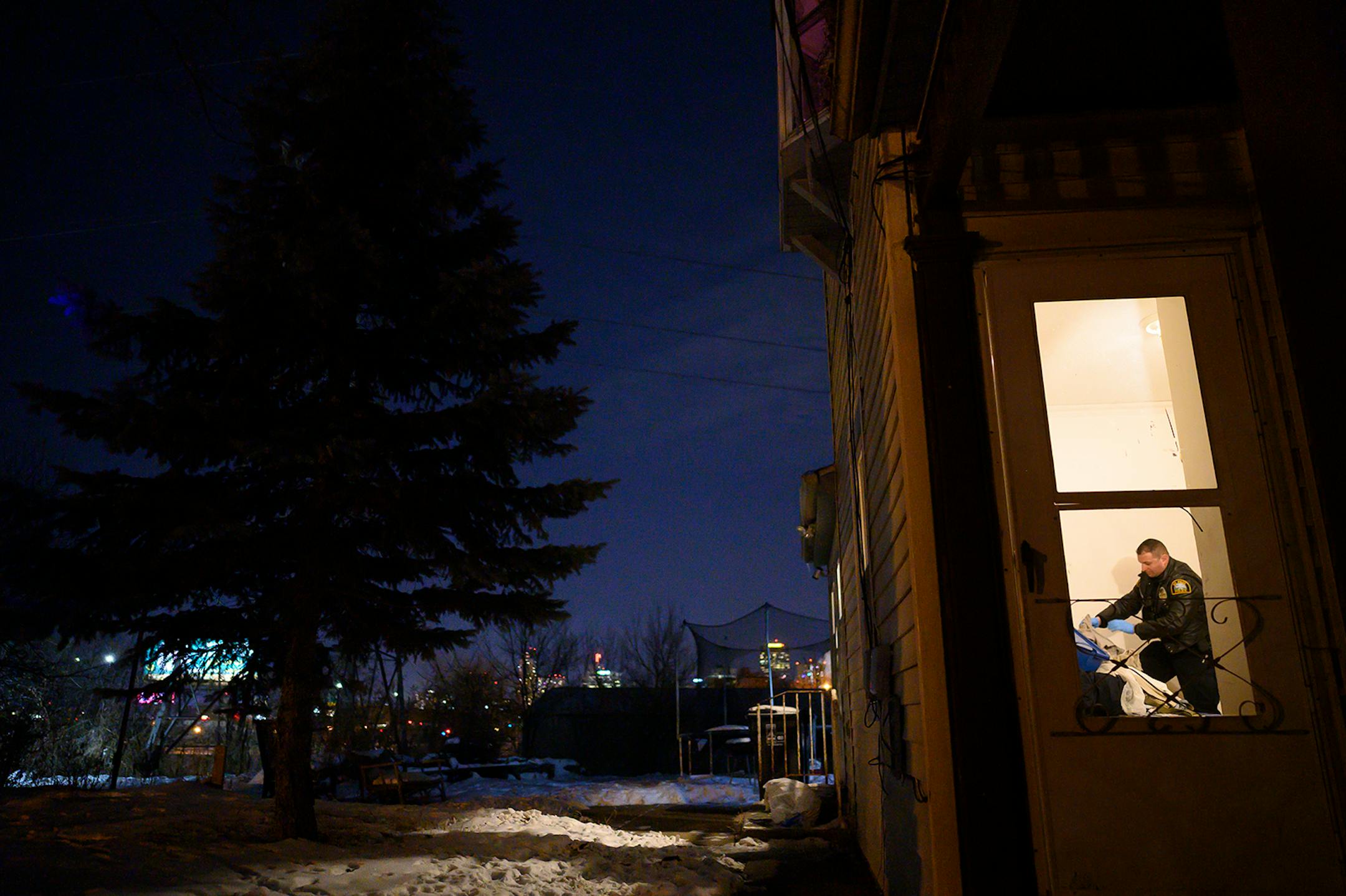 A member of the Saint Paul Police Department's gang unit searched a bedroom while executing a warrant Wednesday which was related to a recent shooting.