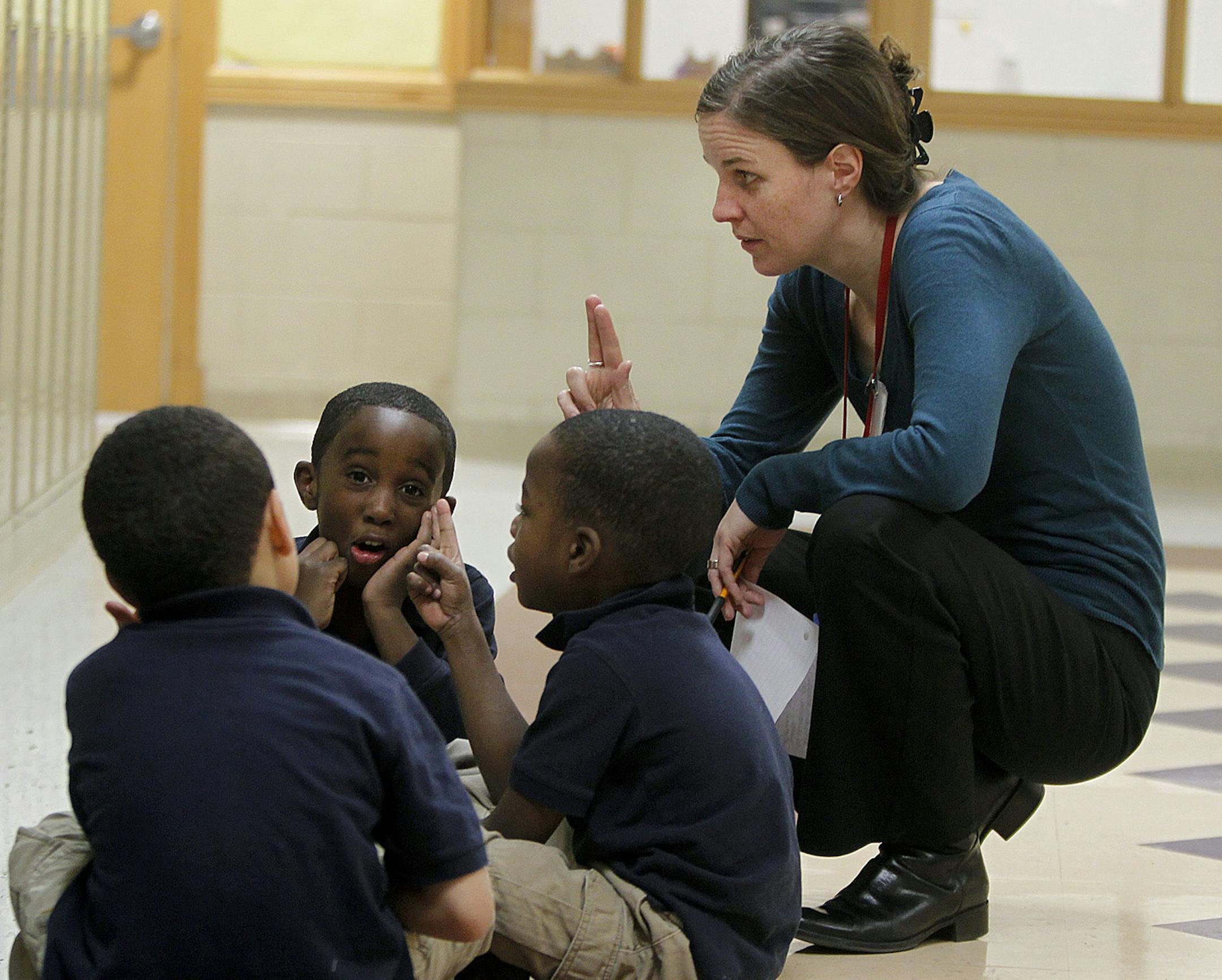 Pierre Bottineau French Immersion principal Tina Maynor taught students the alphabet in the hallway at the new French immersion school named after Pierre Bottineau, Monday, November 5, 2012 in Minneapolis, MN. The French immersion school is the state's first self-governed school. (ELIZABETH FLORES/STAR TRIBUNE) ELIZABETH FLORES ¬• eflores@startribune.com ORG XMIT: MIN1211052112387266