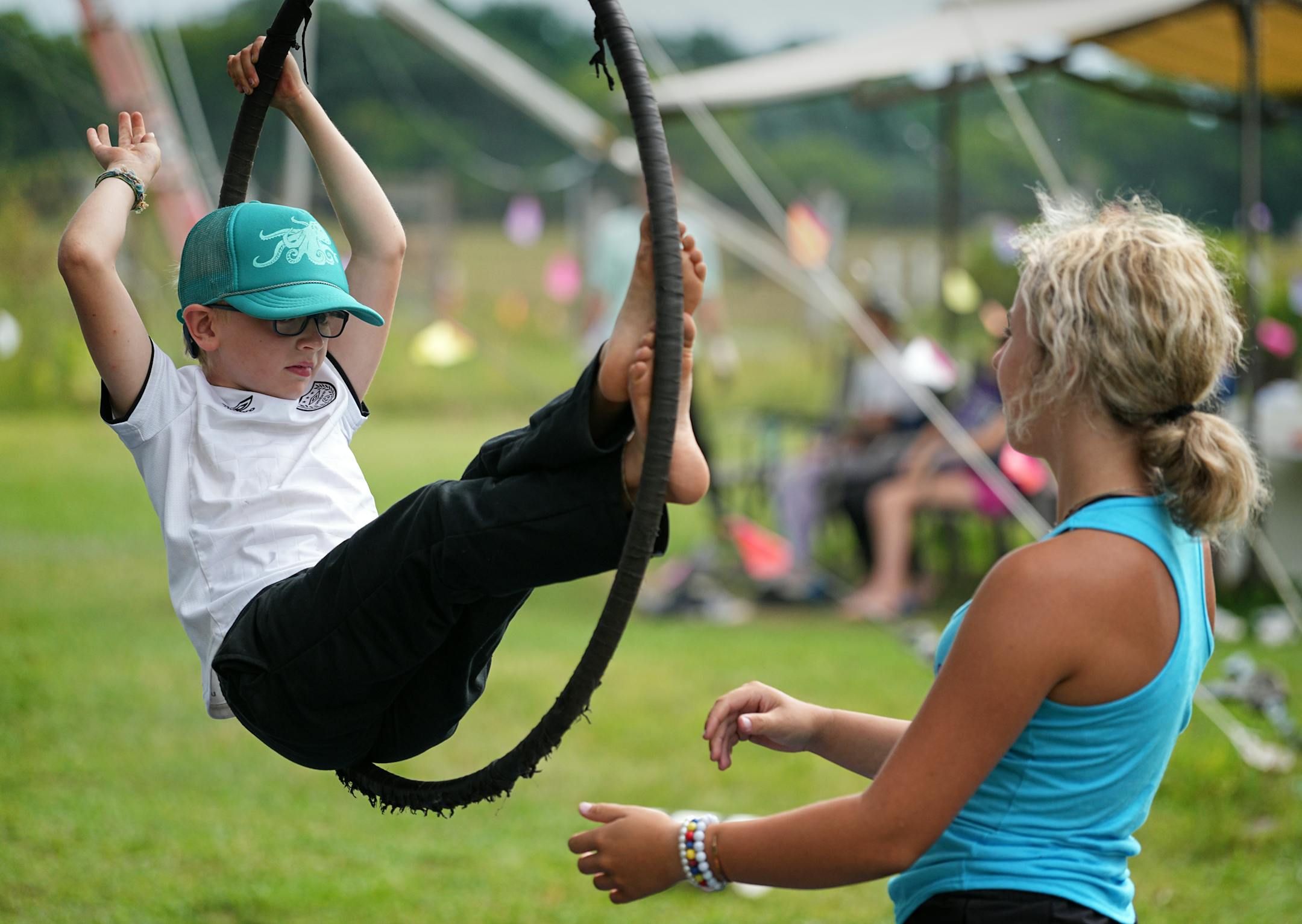 Linus Willette works with coach Quinn Trocke on the aerial lyra hoop at Flying Colors Trapeze school.