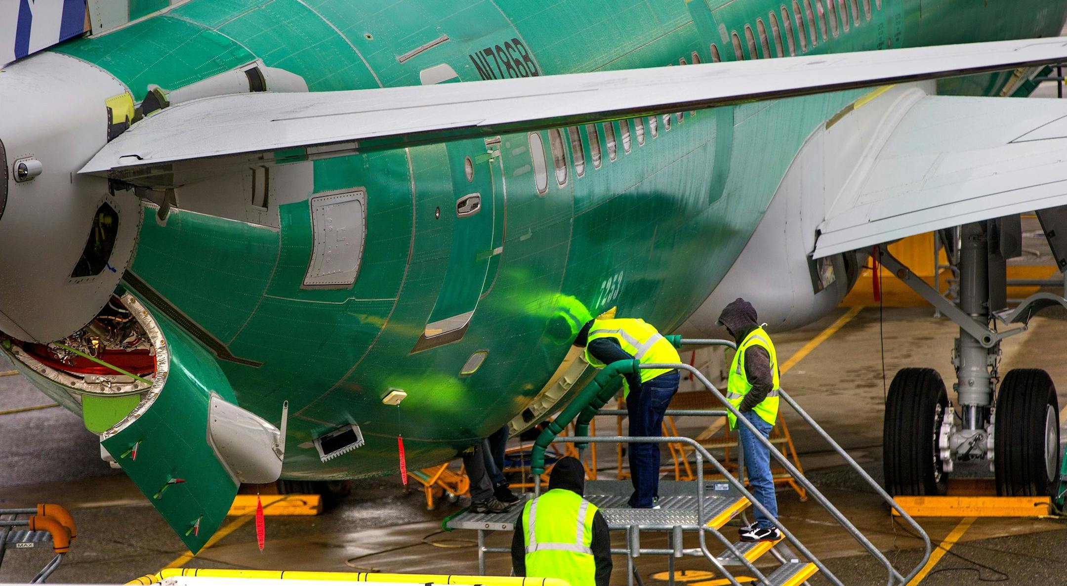 A Boeing 737 MAX airplane being built for United Airlines is worked on next to the runway at the Renton Municipal Airport on Nov. 7, 2018.