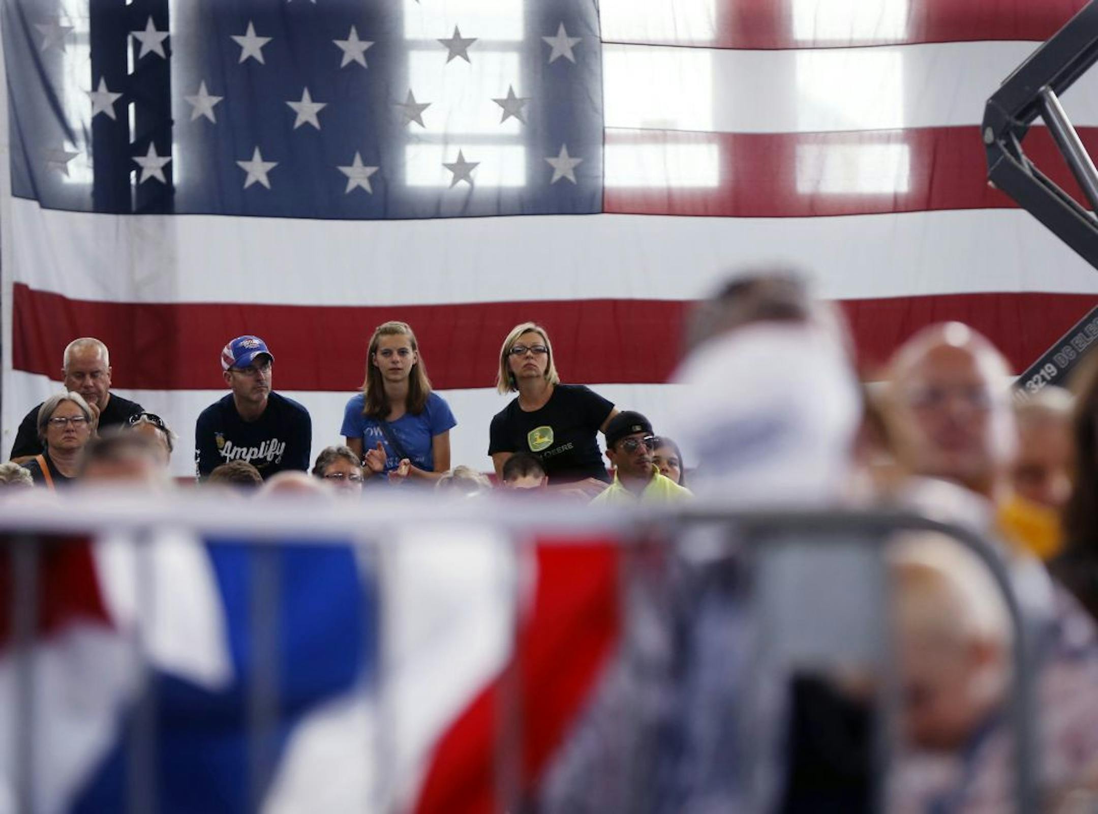 Audience members listen to introductory speakers before Republican presidential candidate Donald Trump speaks at Joni's Roast and Ride at the Iowa State Fairgrounds, in Des Moines, Iowa, Saturday, Aug. 27, 2016.