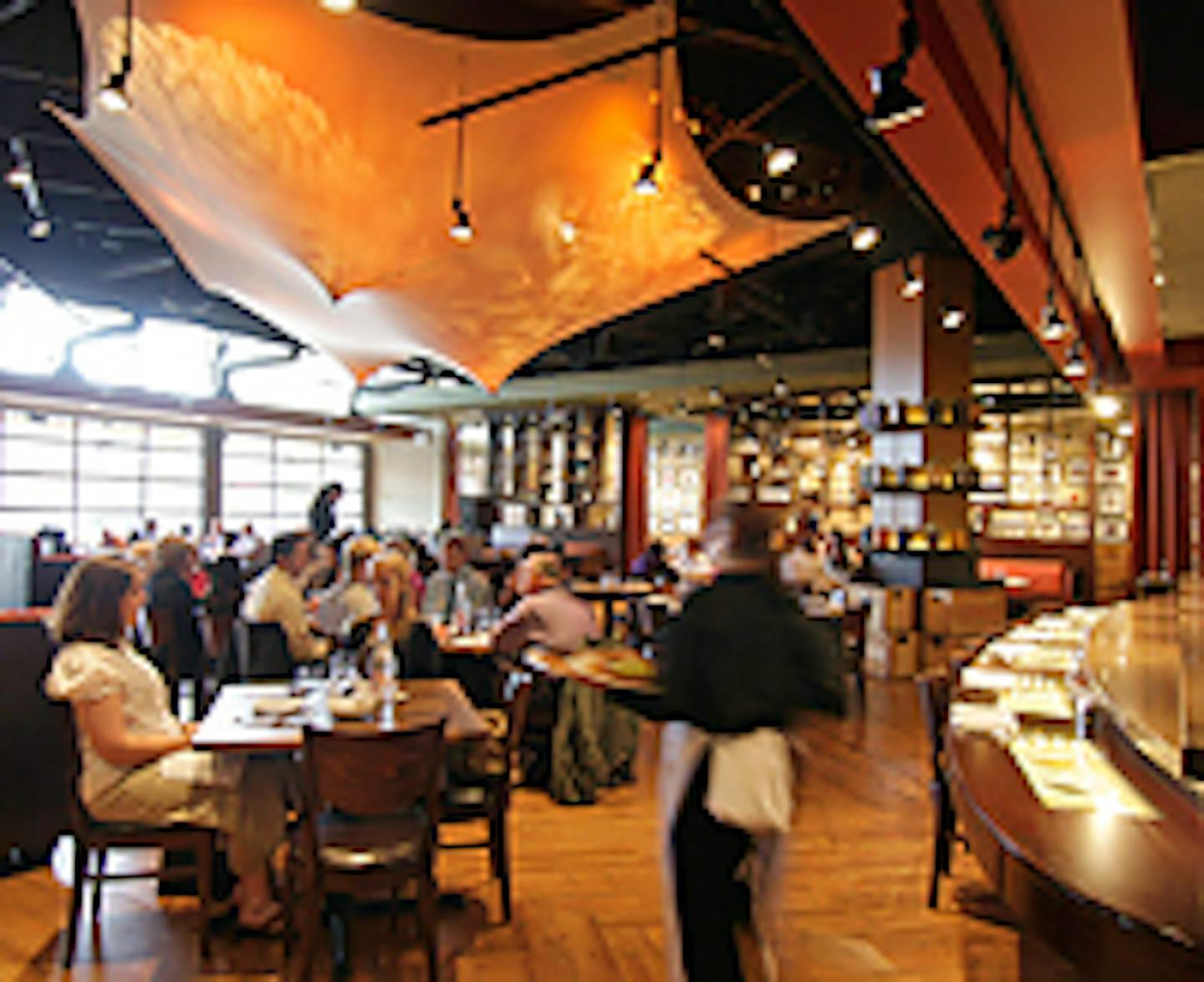 A taut fabric canopy adds a dramatic touch to the dining room at Ringo, located in the Shops at West End in St. Louis Park.