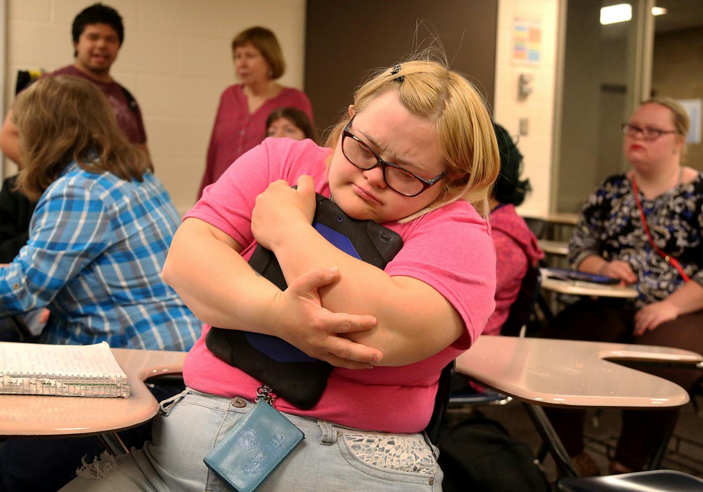 Students who are part of the first class of developmentally-disabled students to graduate from Bethel University took a final exam in "life skills" as part of this unusual program, known as BUILD (Bethel University Inclusive Learning and Development) Thursday, May 25, 2017, in St. Paul, MN. Here, as her final college class came to an end, BUILD student Lauren Thysell held her notebook computer tight. Thysell said she was feeling sad because college was ending for her.] DAVID JOLES &#xef; david.j