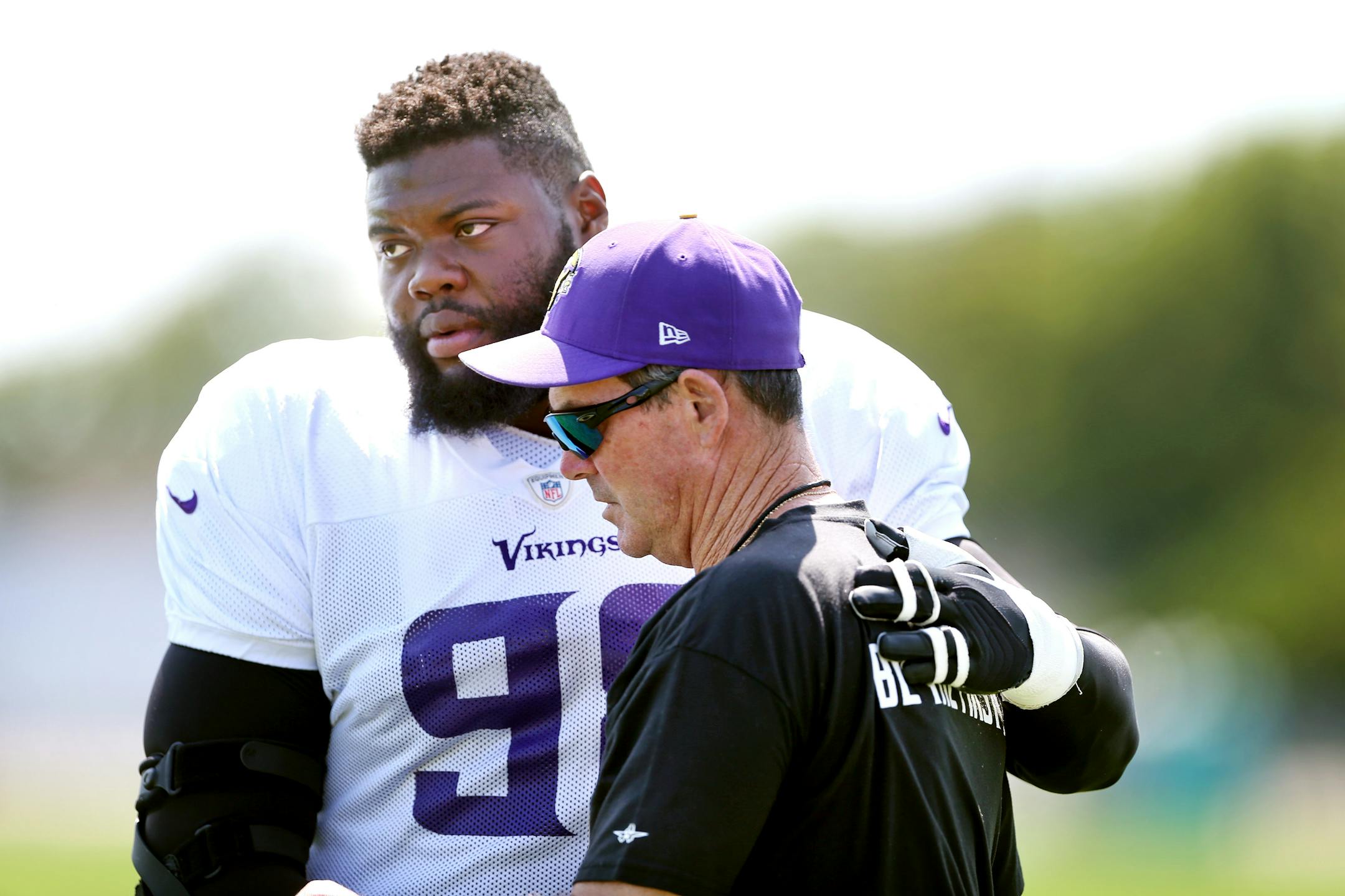 Vikings tackle Linval Joseph hugged head coach Mike Zimmer at Minnesota State University Mankato Wednesday August 12, 2015 in Mankato, MN. Vikings head coach Mike Zimmer's father, Bill, passed away on Tuesday in Naples, Fla. He was 84.