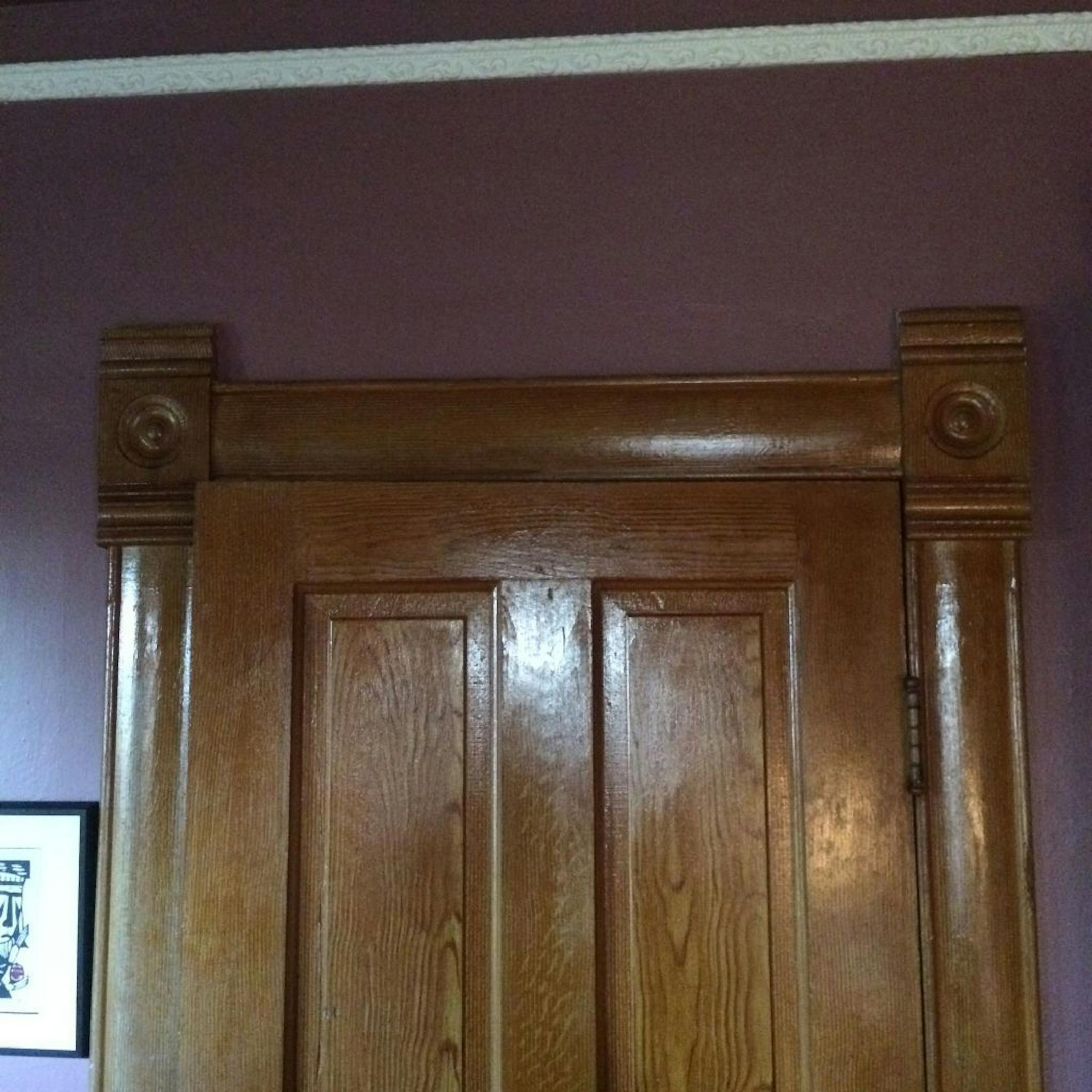 All the new millwork matches the original carved wood corner blocks in the home.