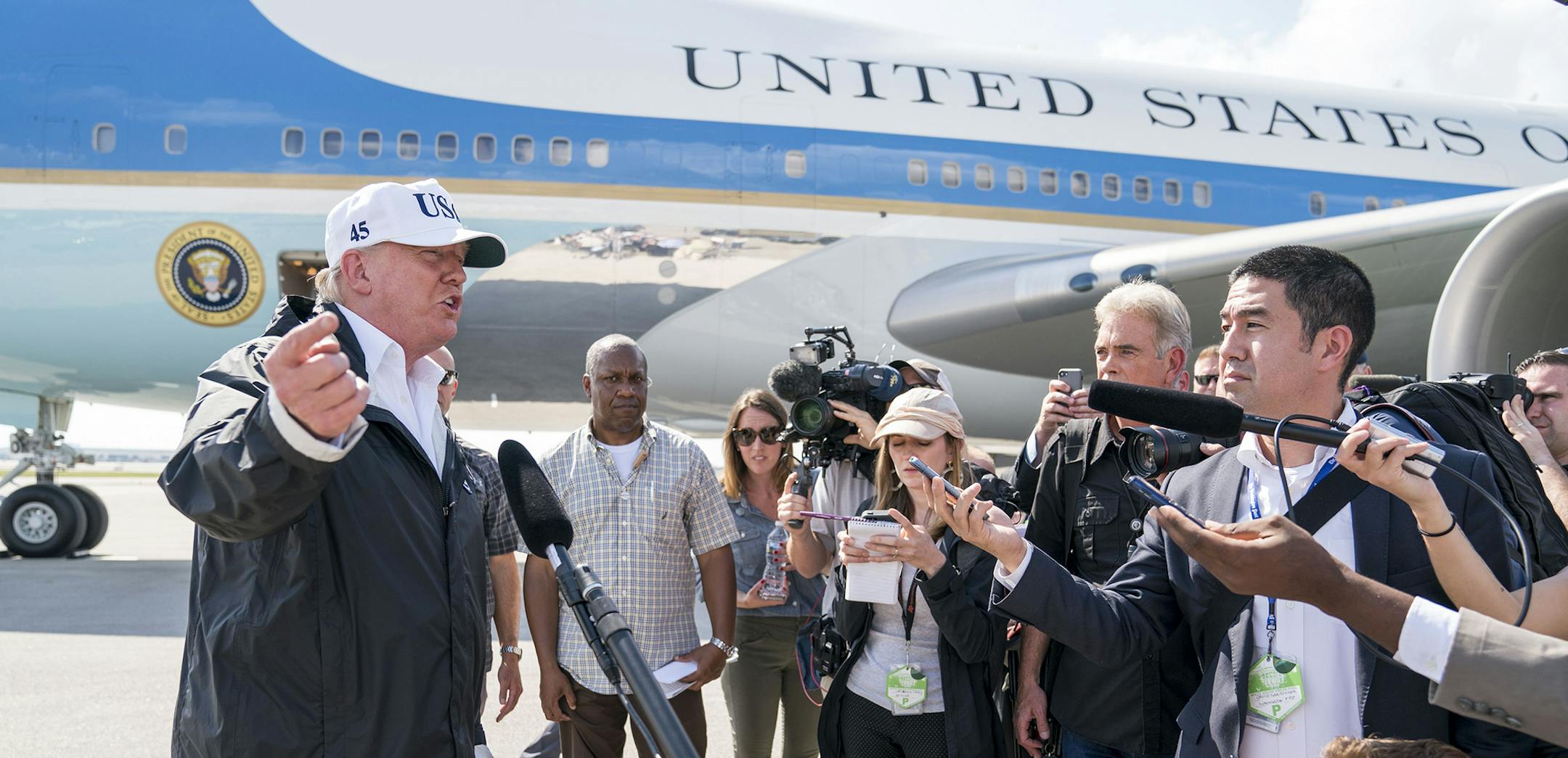 President Donald Trump speaks to reporters about DACA as he arrives to survey recovery efforts after Hurricane Irma in Ft. Myers, Fla., Sept. 14, 2017. From left: Trump, first lady Melania Trump, Ann Scott and her husband, Florida Gov. Rick Scott. (Doug Mills/The New York Times) ORG XMIT: MIN2017091417284151
