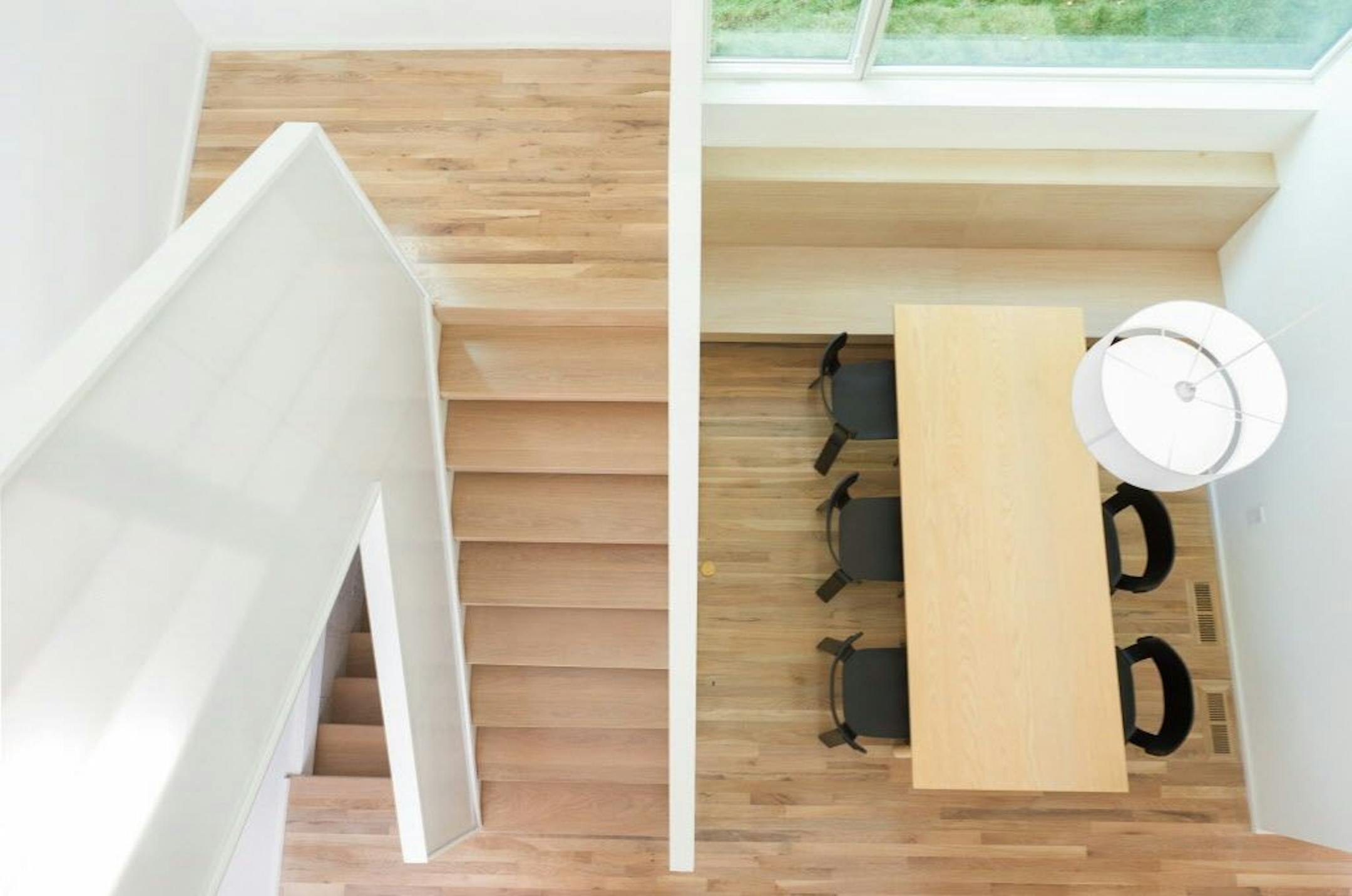 Overhead view of staircase and dining area