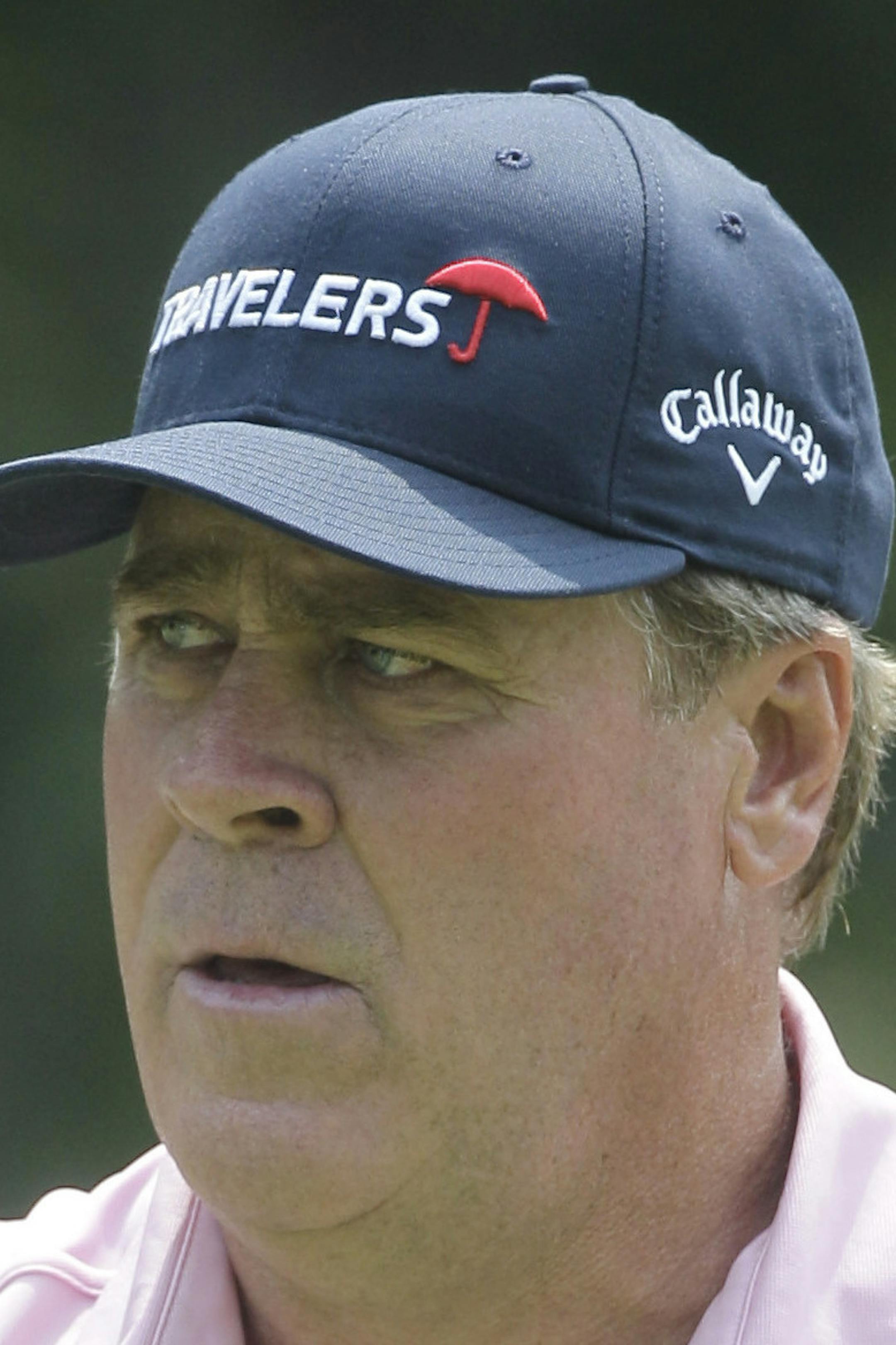 Hal Sutton acknowledges the crowd on the 16th hole during the first round of the U.S. Senior Open golf tournament at the Inverness Club in Toledo, Ohio, Thursday, July 28, 2011. (AP Photo/Carlos Osorio)