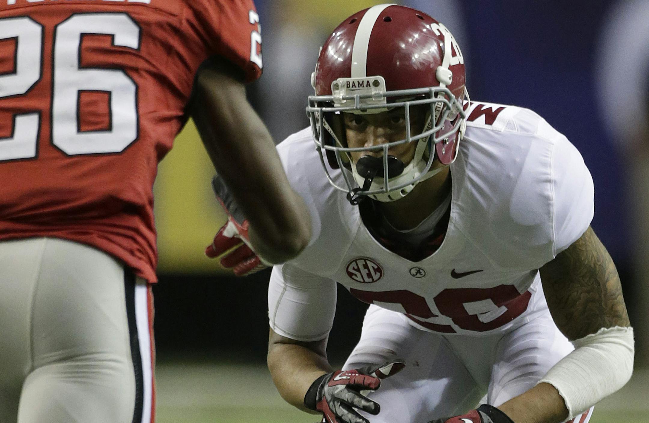 Alabama defensive back Dee Milliner (28) works against Georgia wide receiver Malcolm Mitchell (26) during the second half of the Southeastern Conference championship NCAA college football†game, Saturday, Dec. 1, 2012, in Atlanta. (AP Photo/Dave Martin) ORG XMIT: NYOTK