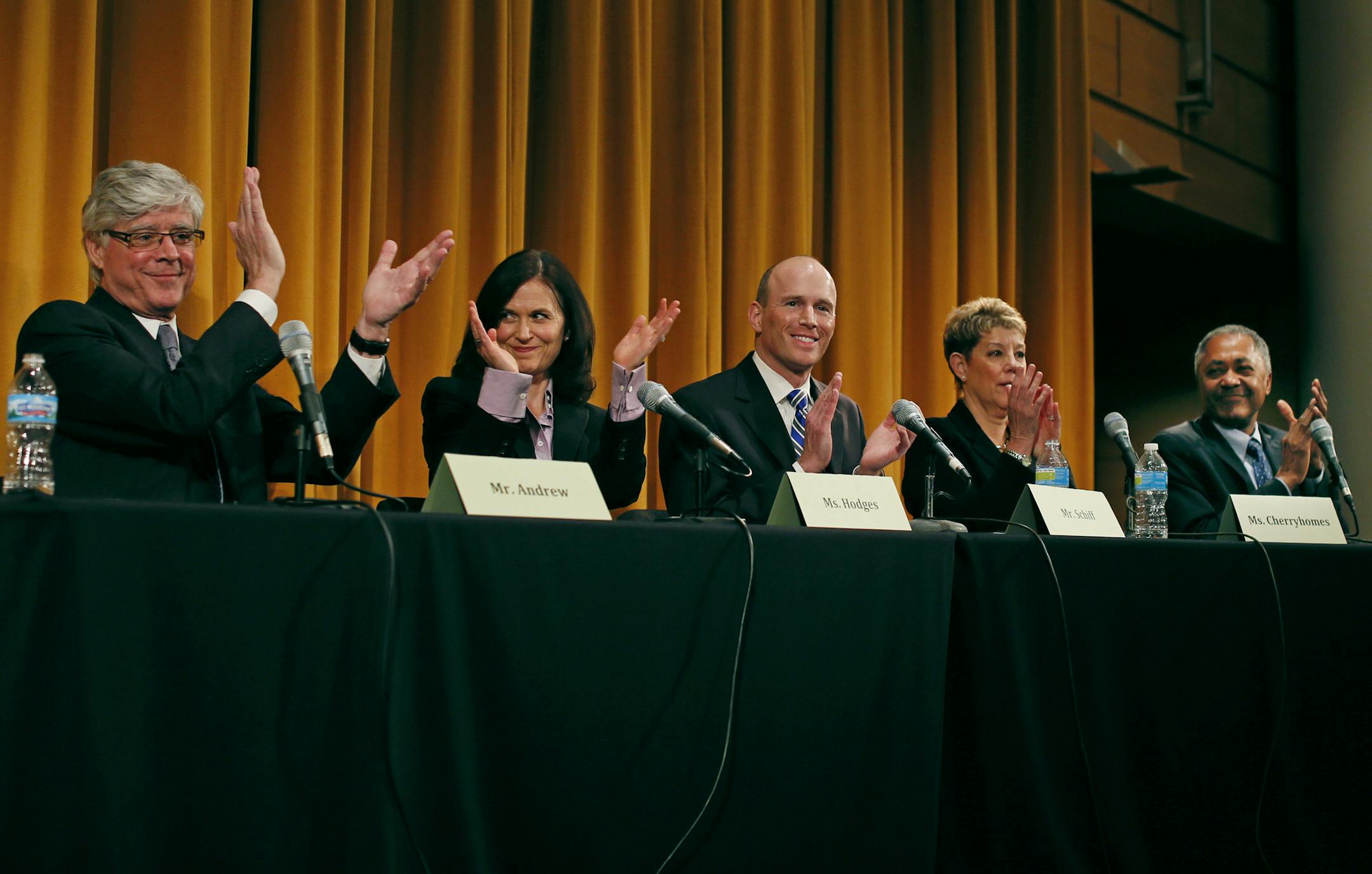 Minneapolis mayoral candidates Mark Andrew, left, Betsy Hodges, Gary Schiff, Jackie Cherryhomes and Don Samuels took part in a debate Wednesday in a packed auditorium at the Humphrey School of Public Affairs. The new Vikings stadium and rising city property taxes were among the main topics.