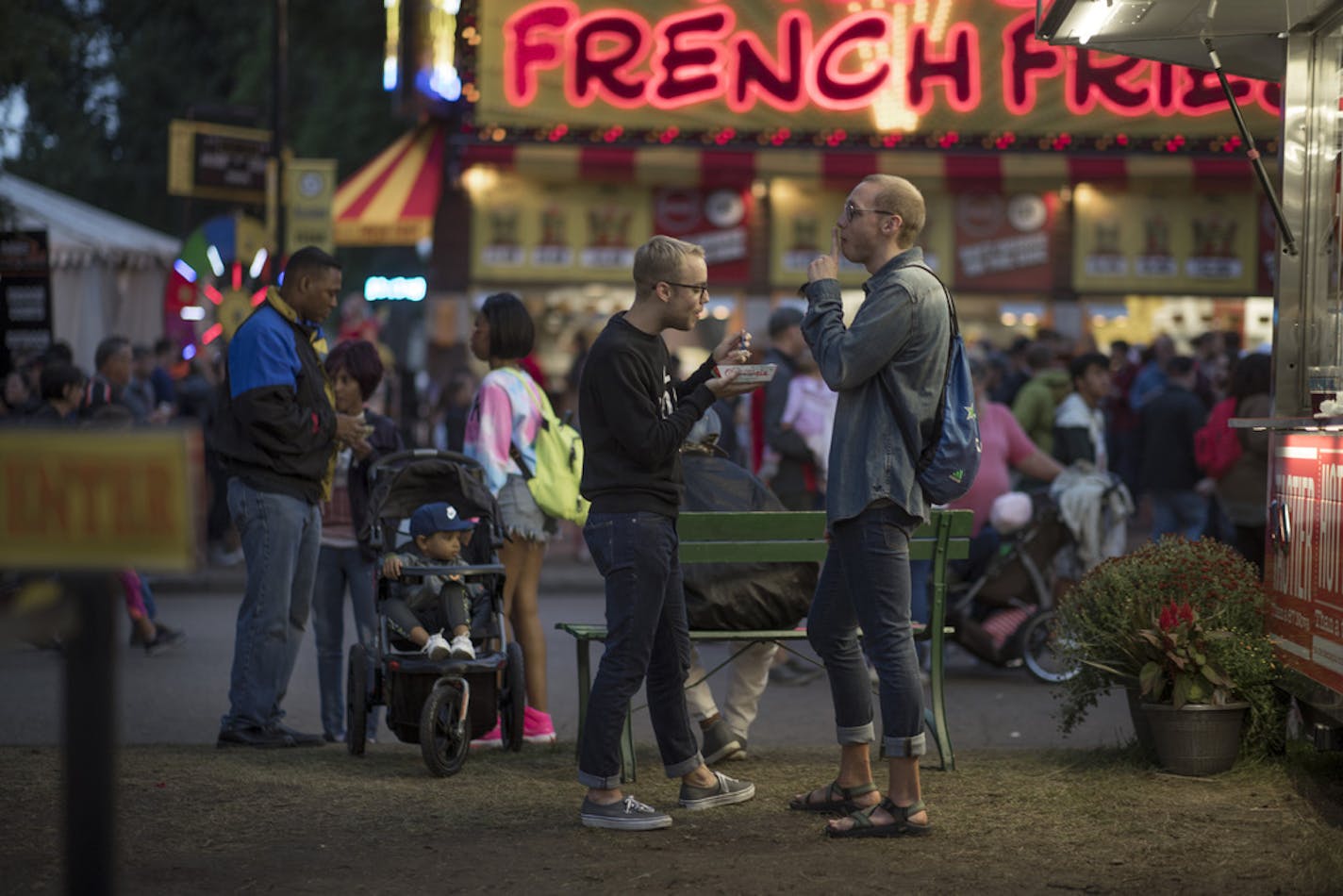 Mike Schutz left, and Matt Pickhartz shared an apple pie and ice cream during their date at the Minnesota State Fairgrounds Tuesday 28, 2018 in Falcon Heights, MN.] JERRY HOLT • jerry.holt@startribune.com