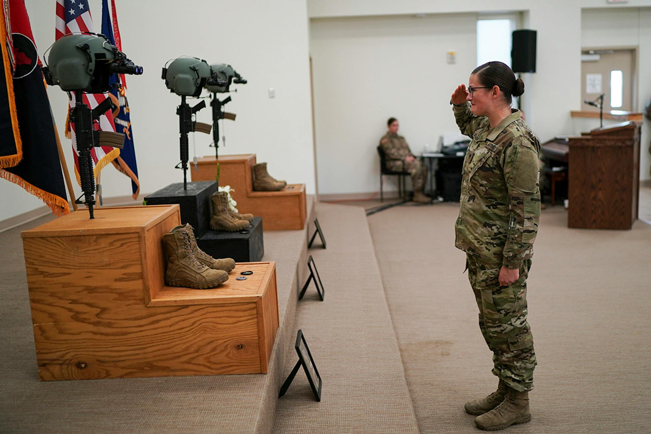 Spc. Nicole Cavanaugh saluted the memorial of Chief Warrant Officer James A. Rogers Jr., during a ceremony in North Fort Hood, Texas on Sunday, December 8, 2019 for the three soldiers who died during a training exercise in Minnesota last week.