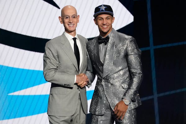 Jalen Suggs, right, posed with NBA Commissioner Adam Silver after being selected fifth overall by the Magic in Thursday’s draft.