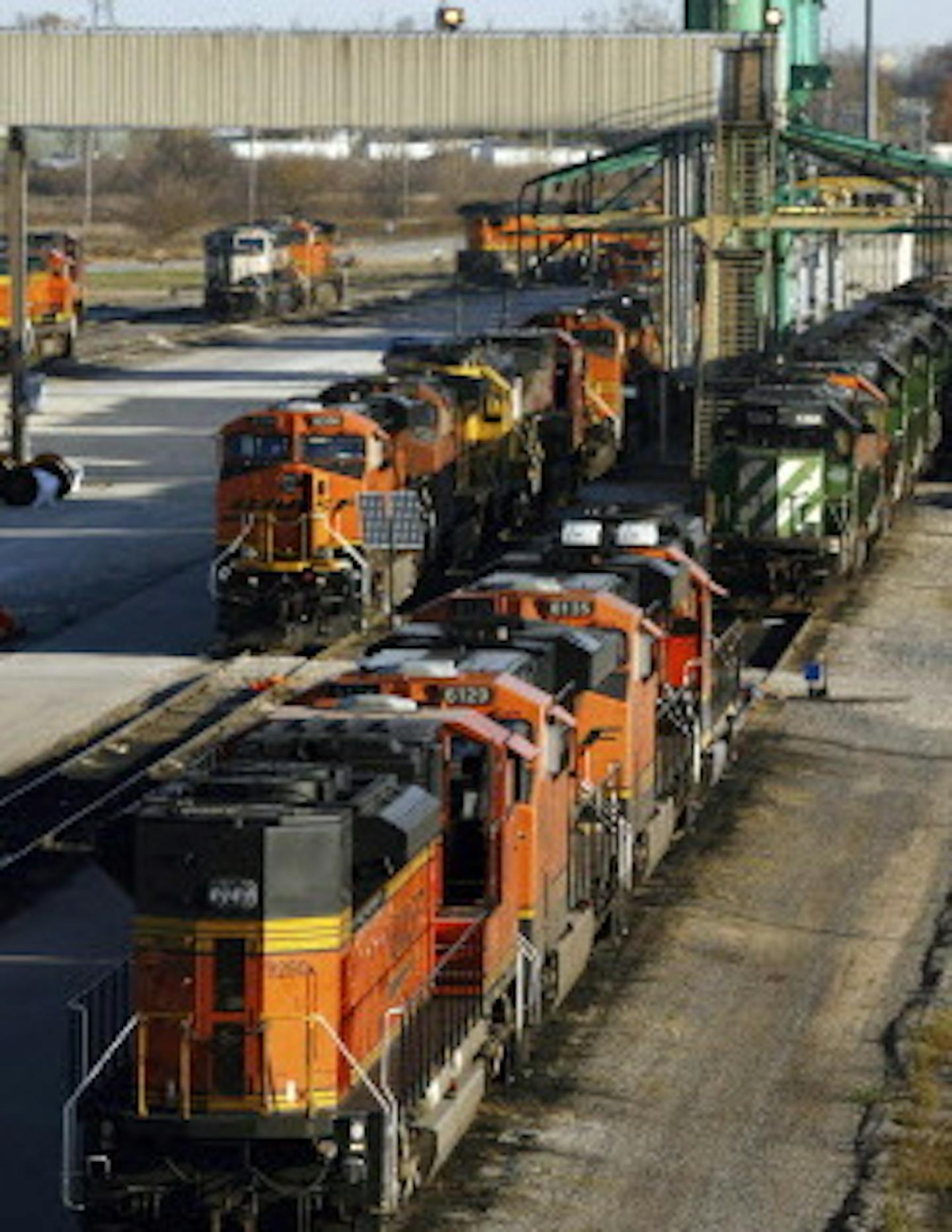 Burlington Northern Sante Fe locomotives are seen at a maintenance and overhaul building Tuesday, Nov. 3, 2009, at the BNSF railyard in Galesburg, Ill. Warren Buffett's Berkshire Hathaway Inc. on Tuesday agreed to buy Burlington Northern Santa Fe Corp. for $34 billion. (AP Photo/The Register-Mail, Bill Gaither)