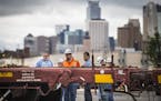 A rail worker spoke to officers at the scene of a fatal incident involving a train at BNSF Railway on Harrison St. in Minneapolis, Minn. on Monday, Ma
