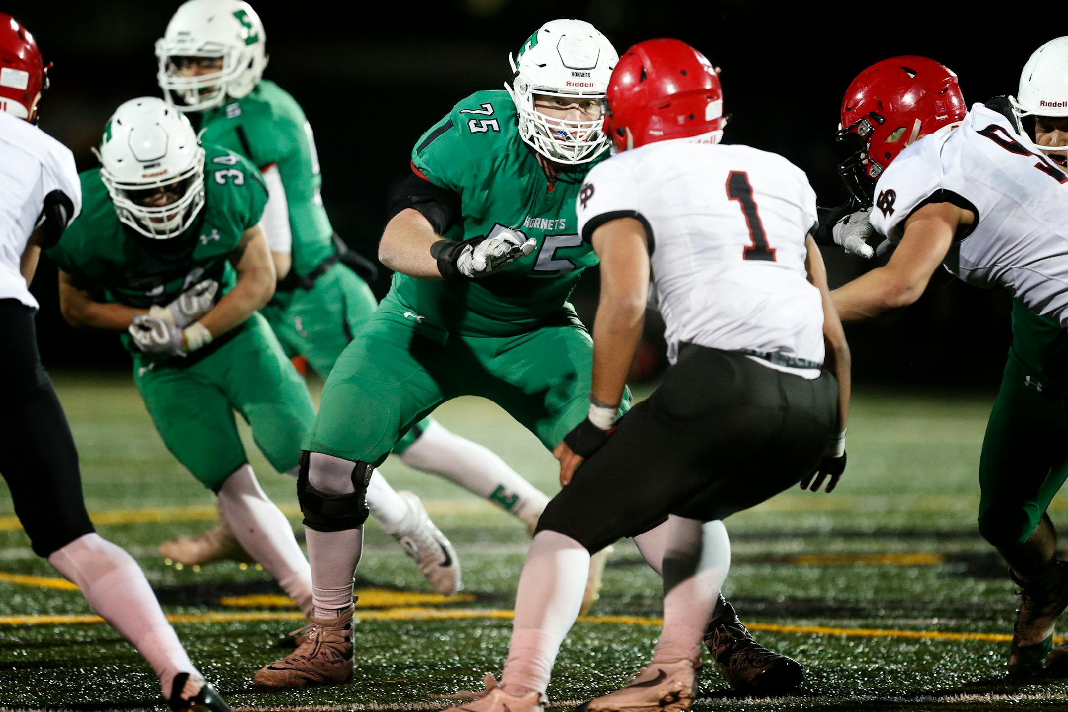 Edina High School offensive lineman Quinn Carroll (75) blocks Eden Prairie High School linebacker Antonio Montero (1). ] LEILA NAVIDI � leila.navidi@startribune.com BACKGROUND INFORMATION: Eden Prairie High School football at Edina High School on Wednesday, October 18, 2017.