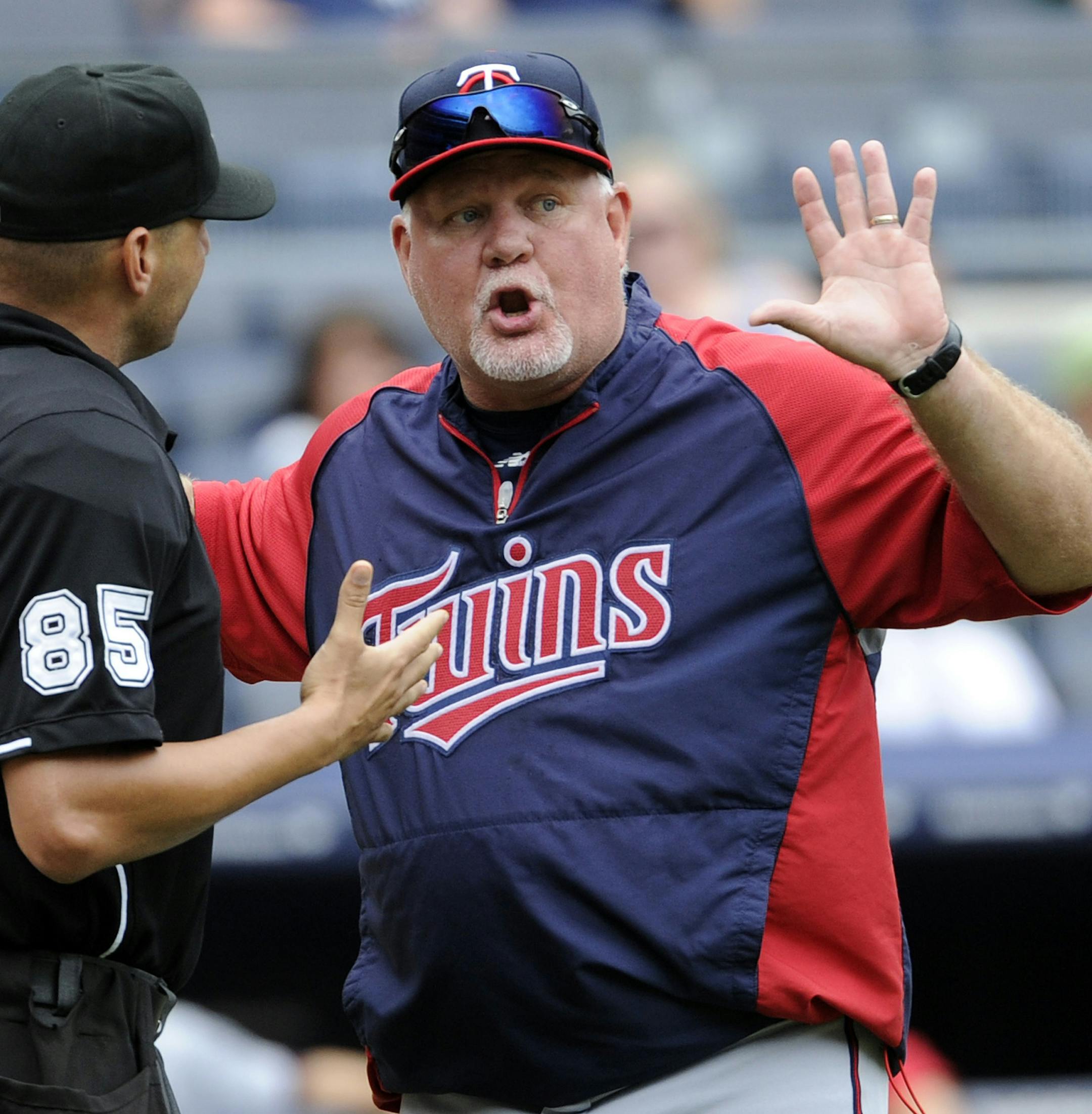 Minnesota Twins manager Ron Gardenhire argues with home plate umpire Vic Carapazza during the eighth inning of a baseball game against the New York Yankees Saturday, July 13, 2013, at Yankee Stadium in New York. (AP Photo/Bill Kostroun) ORG XMIT: MIN2013071315020305