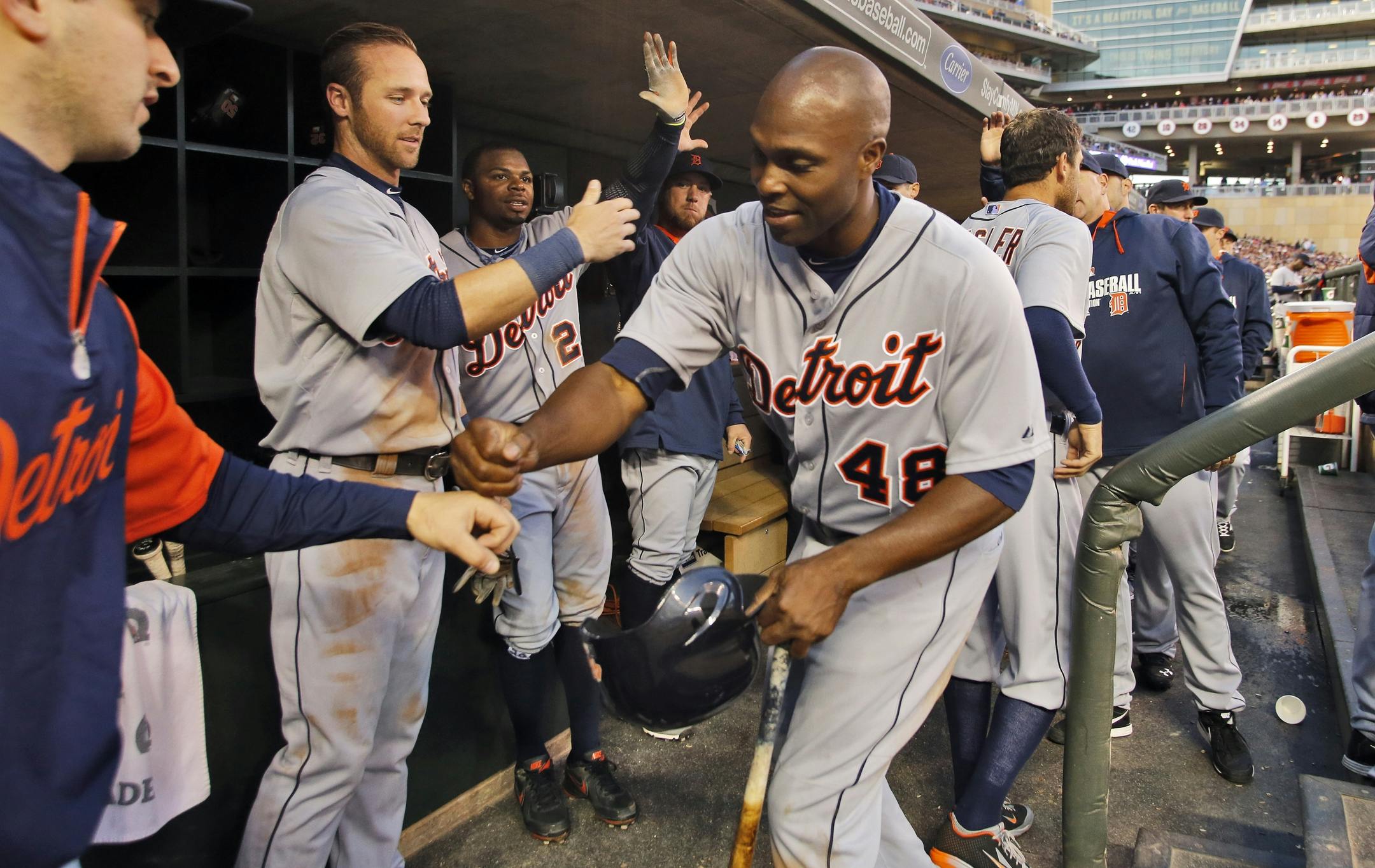 Tigers Torii Hunter was congratulated in the dugout after he scored a run in the 3rd inning on Friday.
