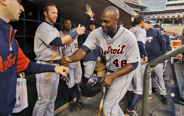 Tigers Torii Hunter was congratulated in the dugout after he scored a run in the 3rd inning on Friday.