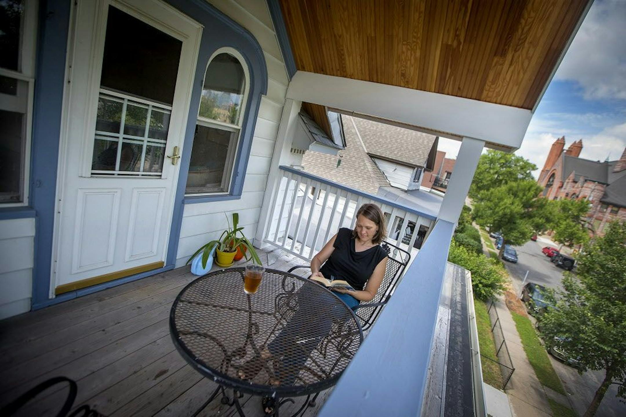 Flisrand on her balcony, where she likes to read and drink tea.
