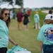 Julie Lovaas passed out tee shirts with Amy Olson photograph on at Hazeltine National Golf Club Thursday June 20, 2019 in Chaska, MN.] Olson is from O