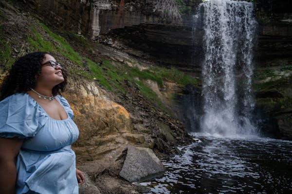 Leinani Watson, who finds waterfalls relaxing in battling anxiety and depression, at Minnehaha Falls in Minneapolis.